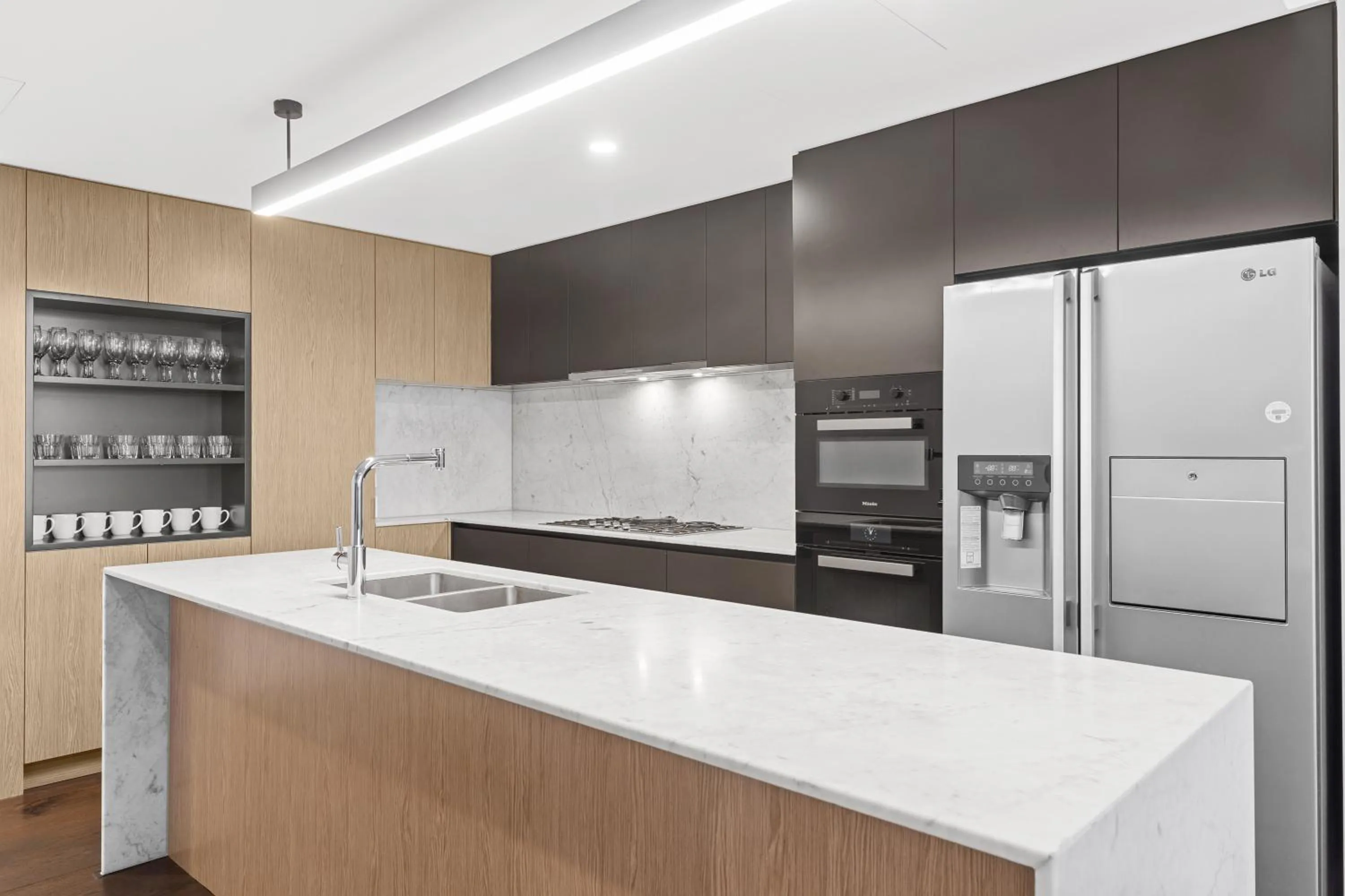 kitchen in Brisbane One Apartments by CLLIX