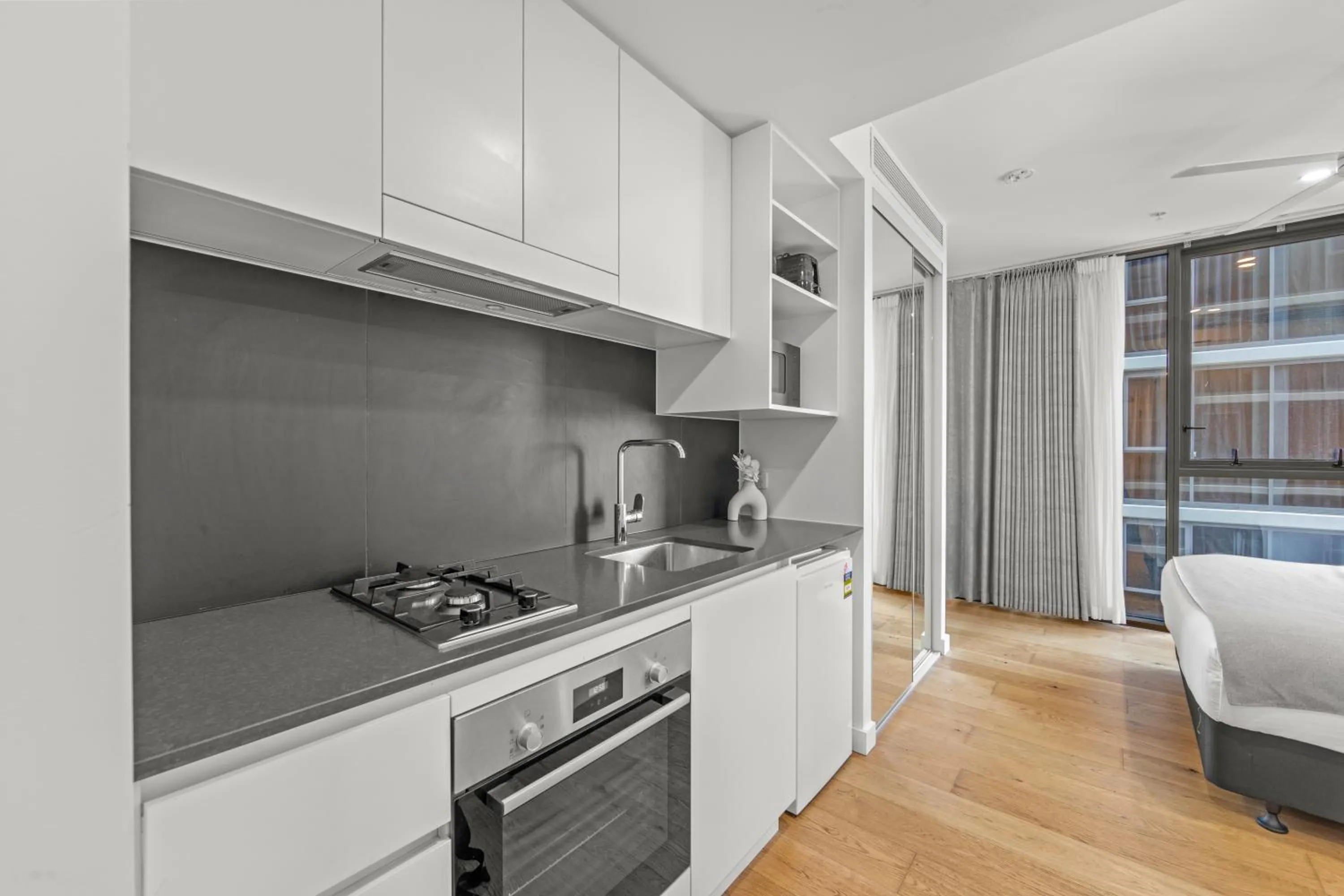 kitchen in Brisbane One Apartments by CLLIX