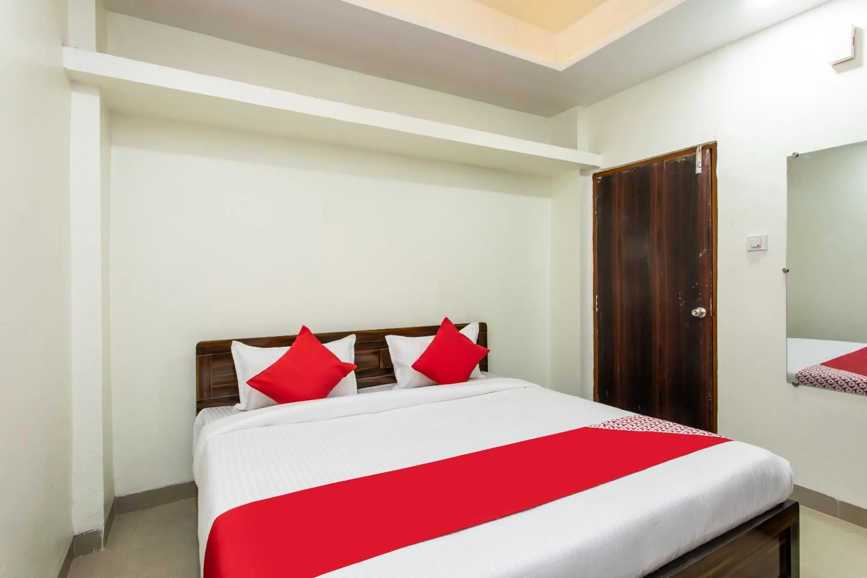 Bedroom in Hotel O Manjulam Regency
