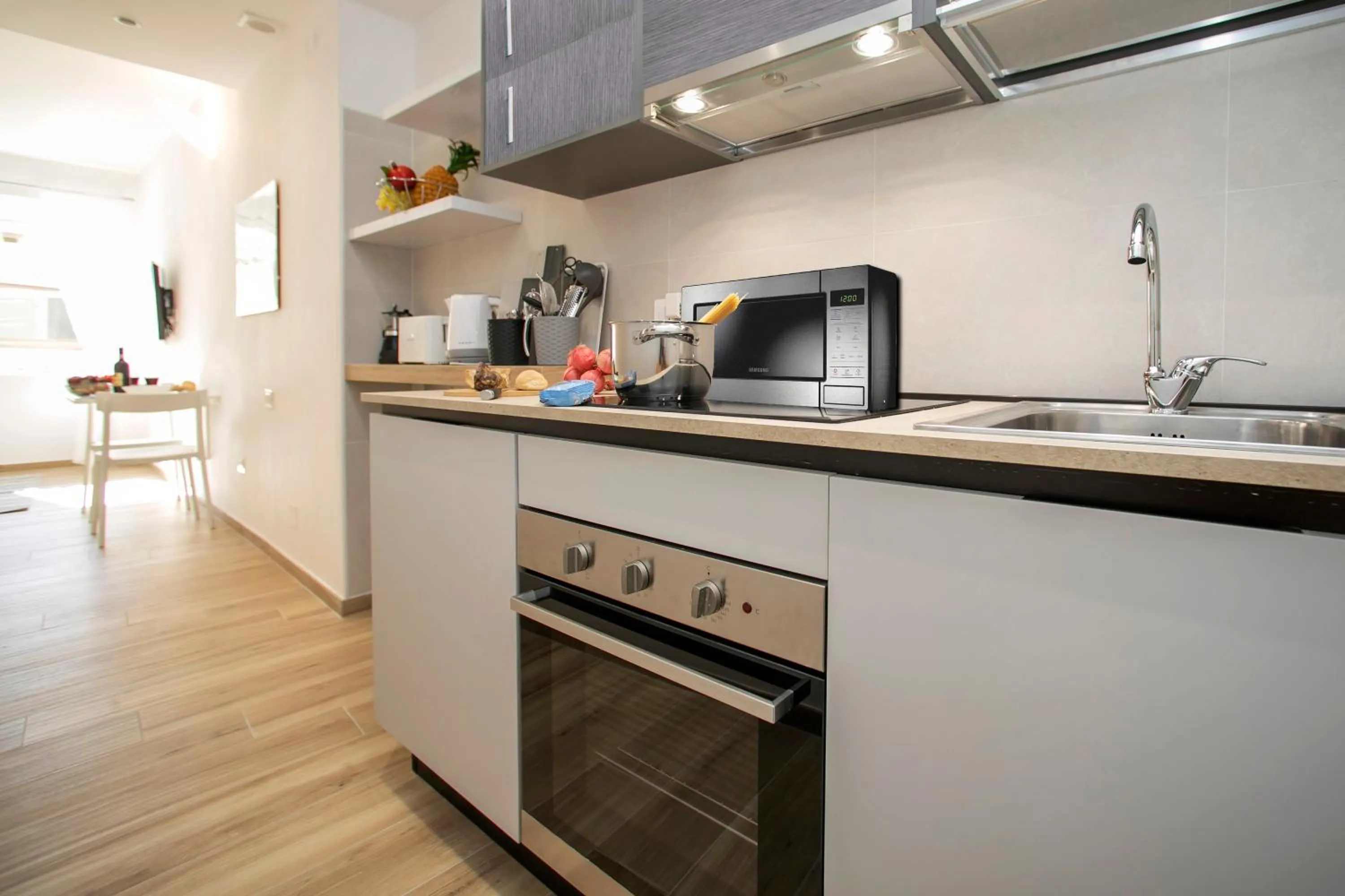Kitchen or kitchenette in Nido sui Tetti di Riva del Garda - Happy Rentals