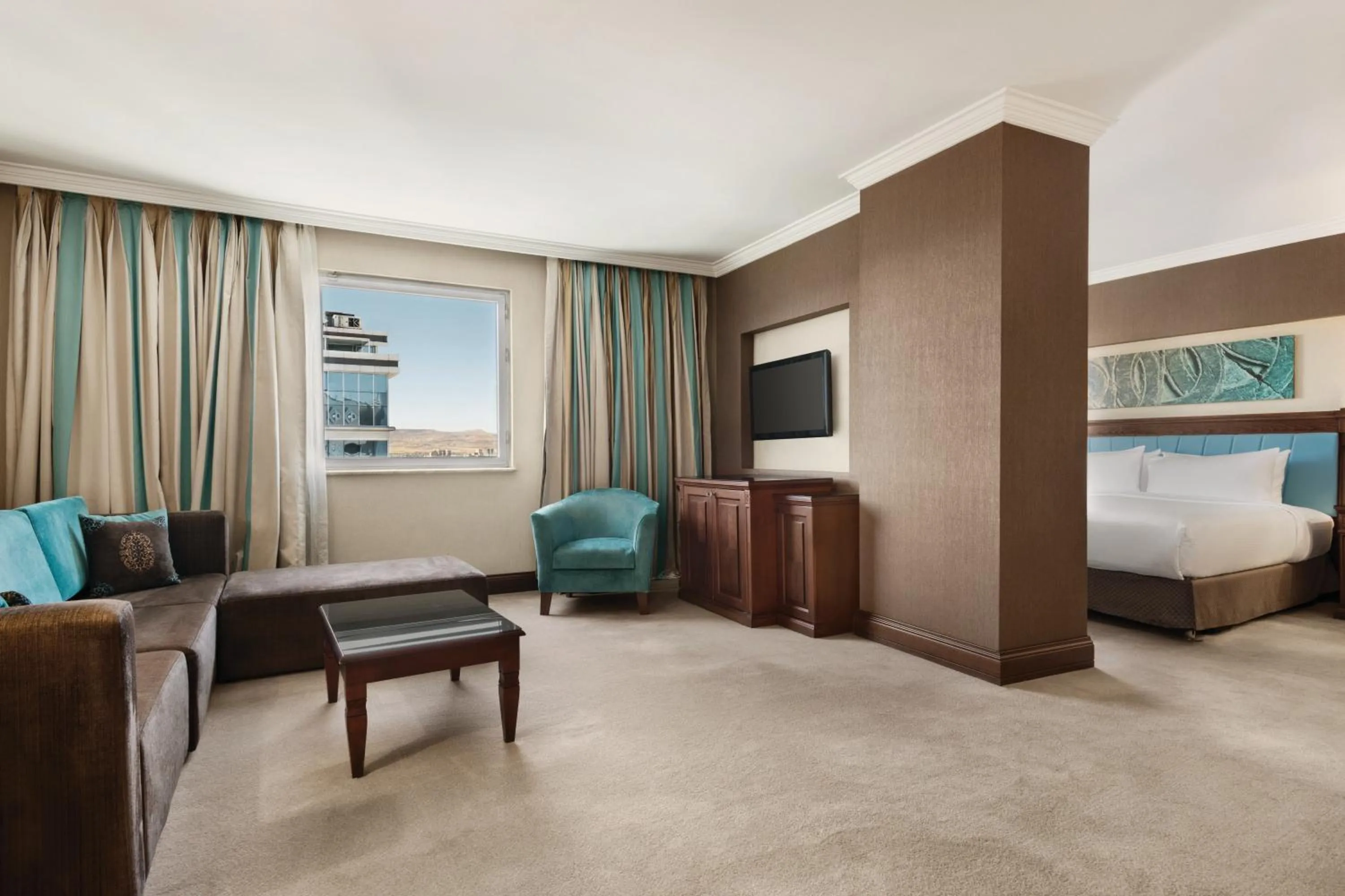 Living room, Bed in Wyndham Grand Kayseri