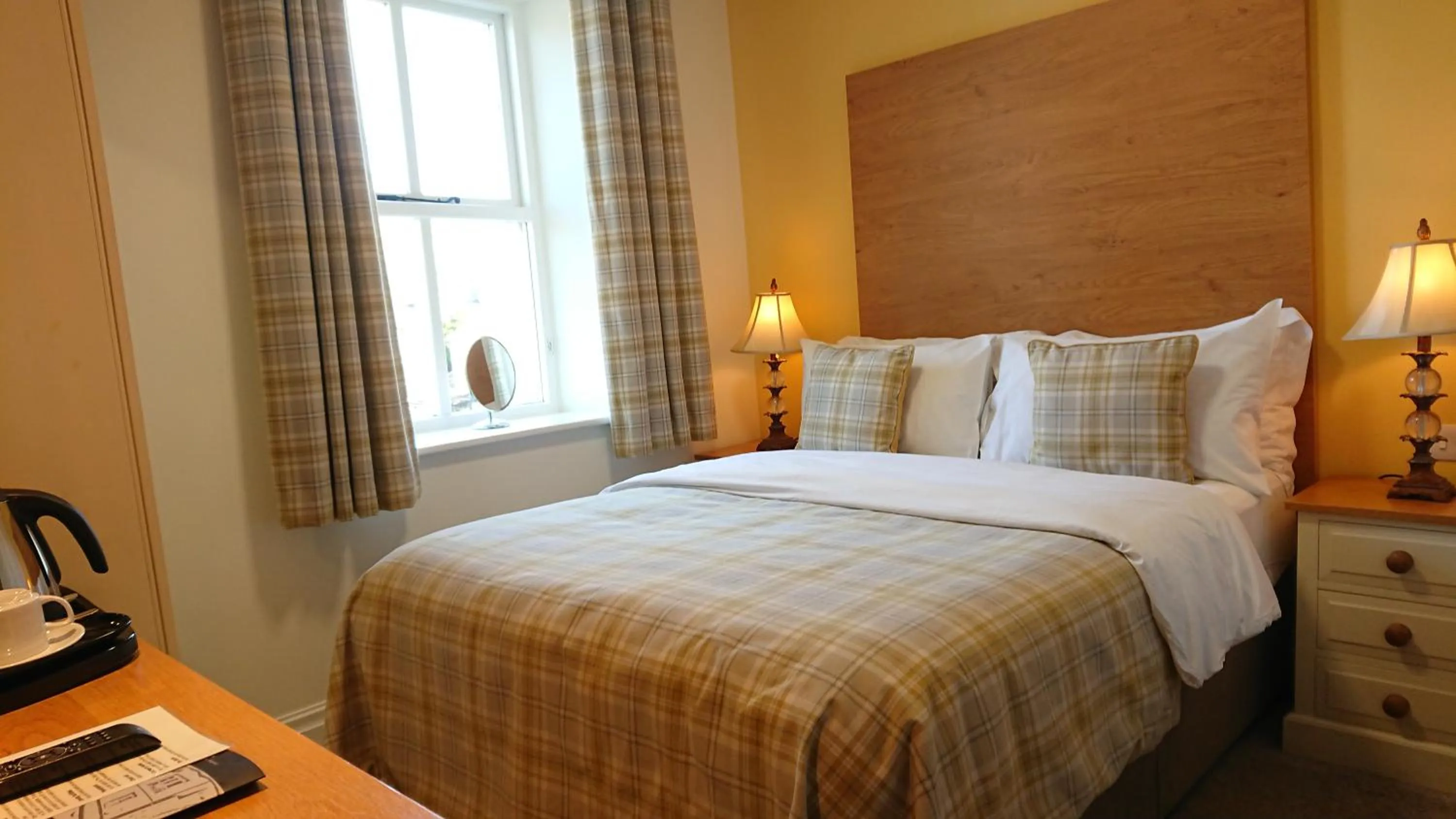 Bed in The Craven Heifer Inn