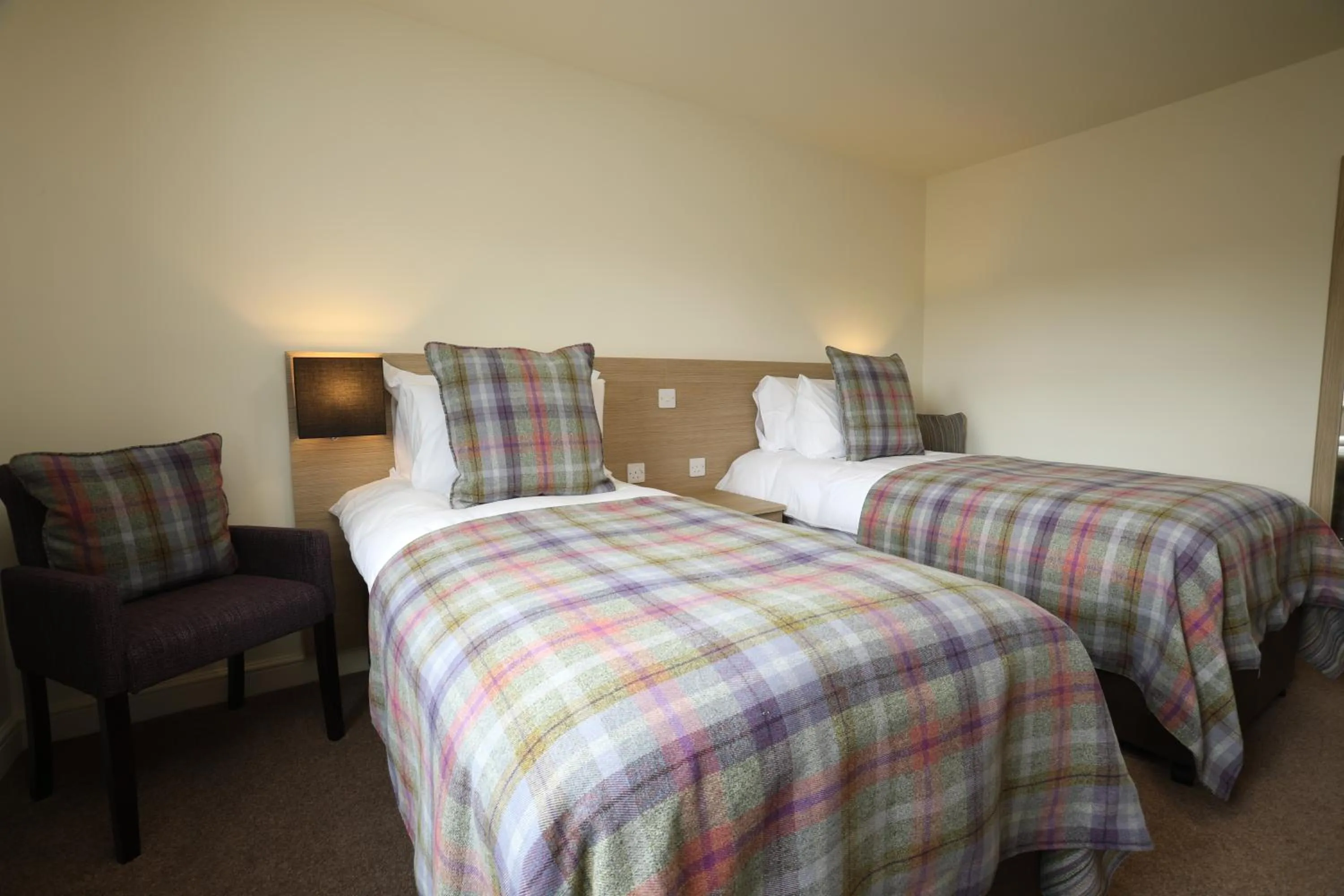 Bed in The Craven Heifer Inn