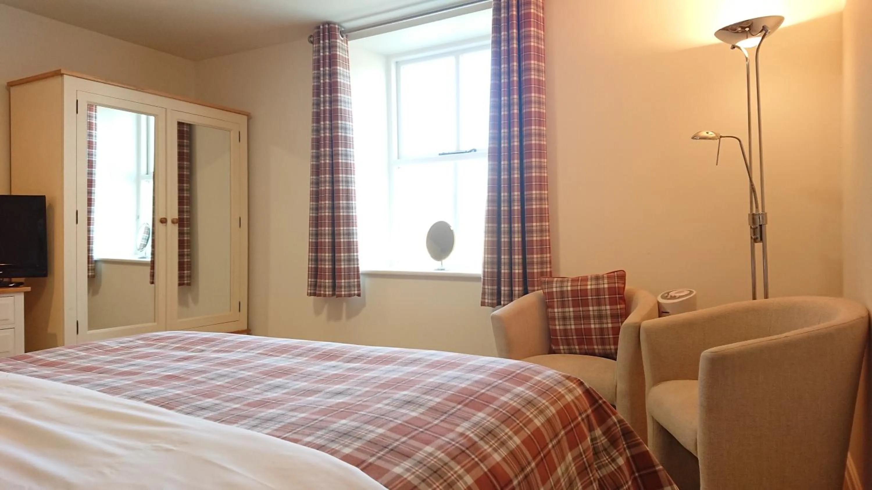 Bed in The Craven Heifer Inn