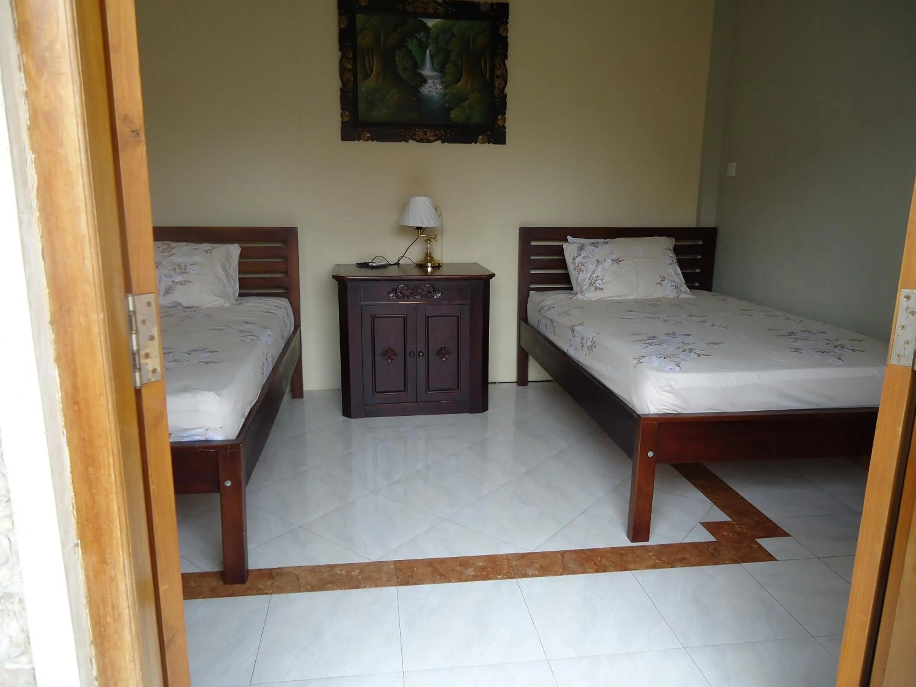 Photo of the whole room, Bed in The Reinhold Guesthouse Bali