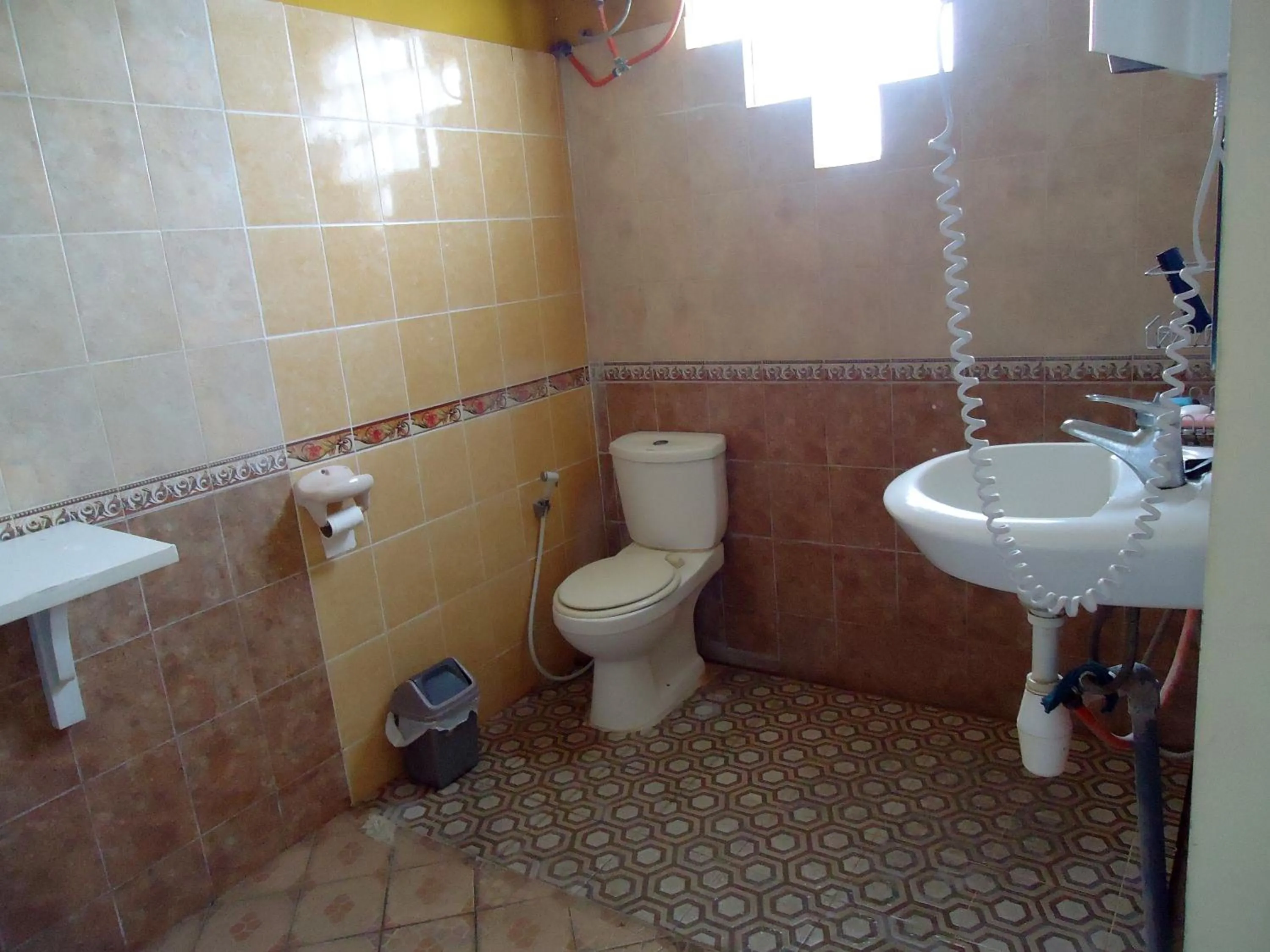 Toilet in The Reinhold Guesthouse Bali