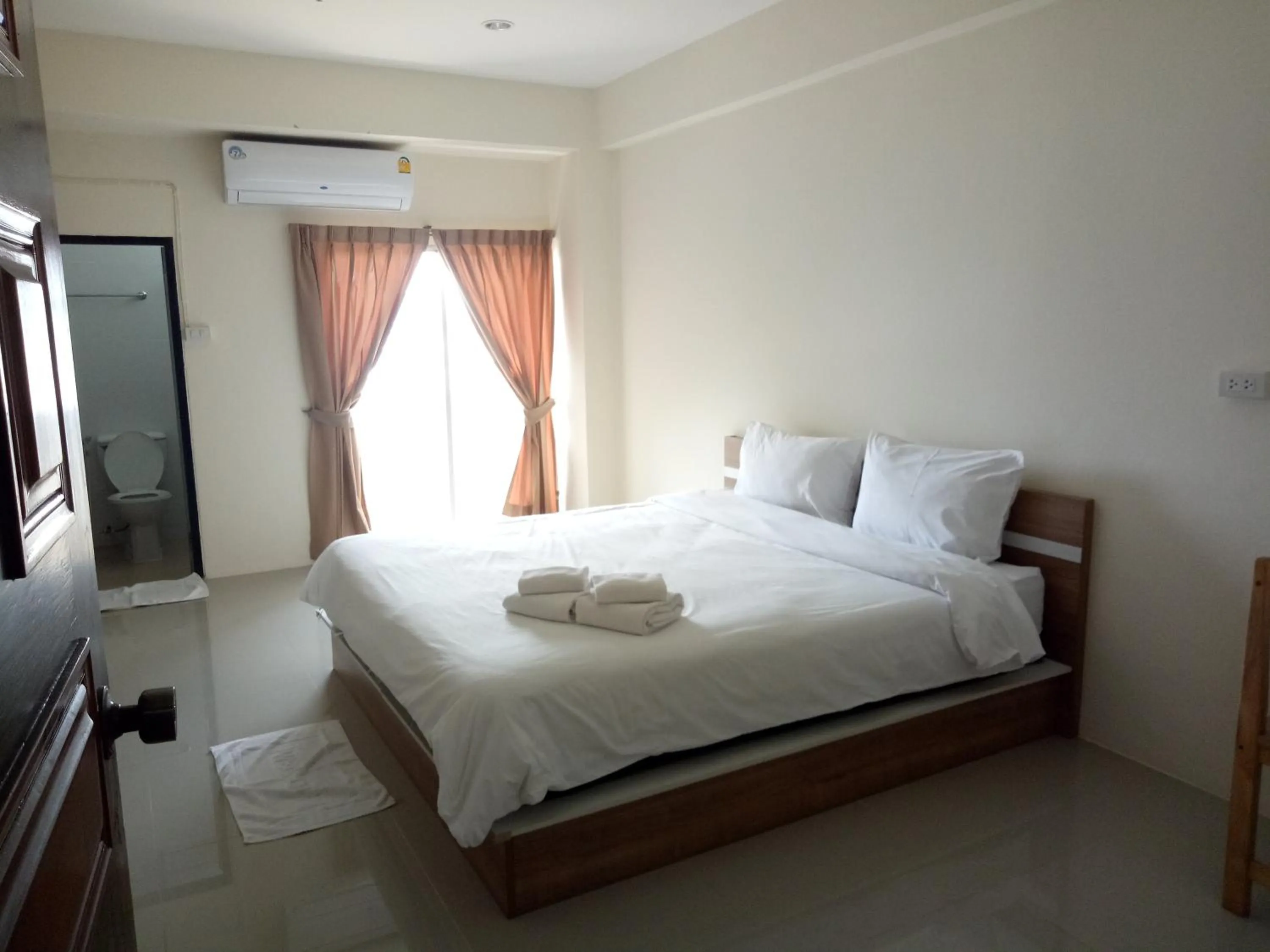 Bed in Komol Residence Bangkok