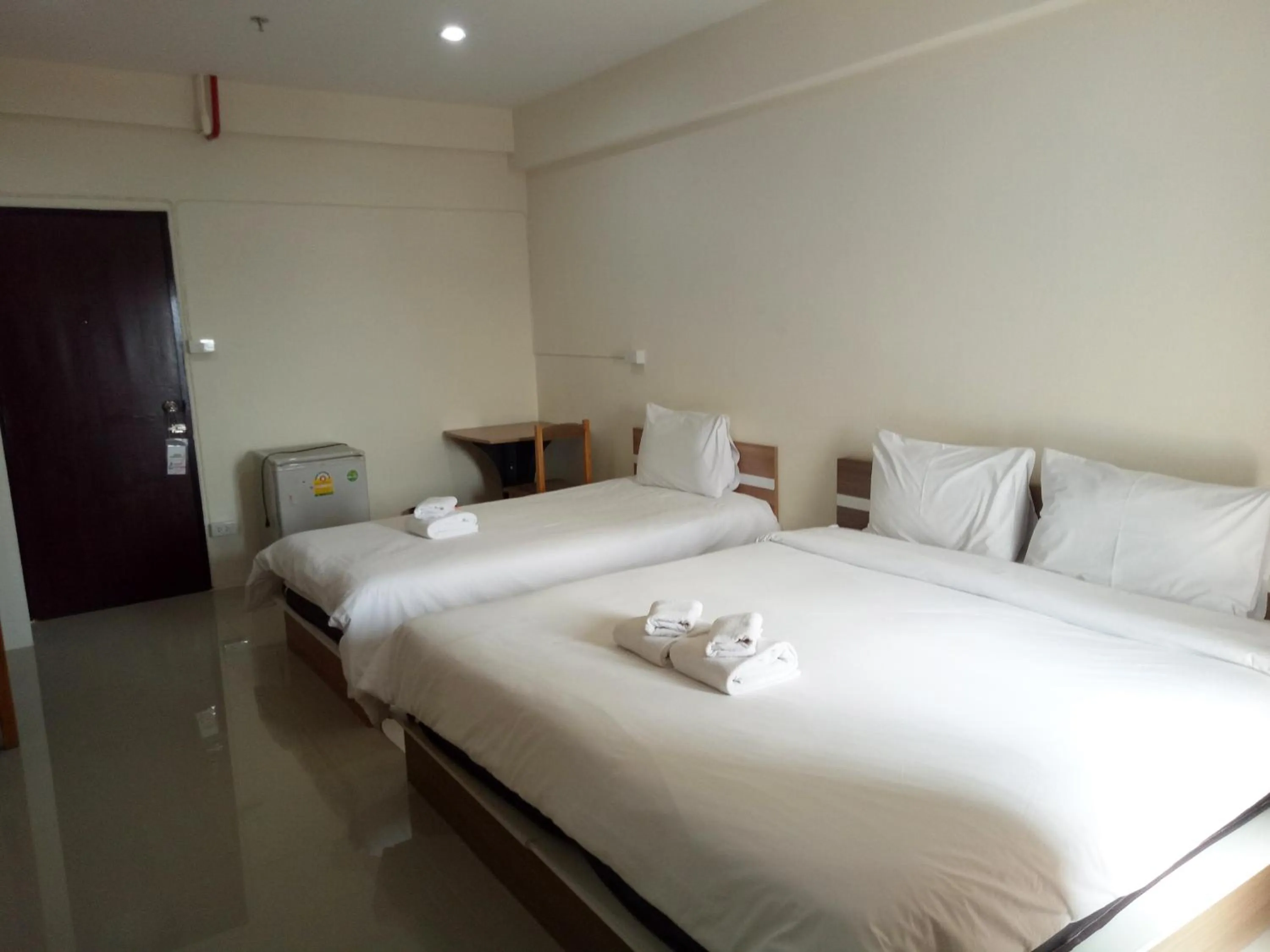 Bed in Komol Residence Bangkok