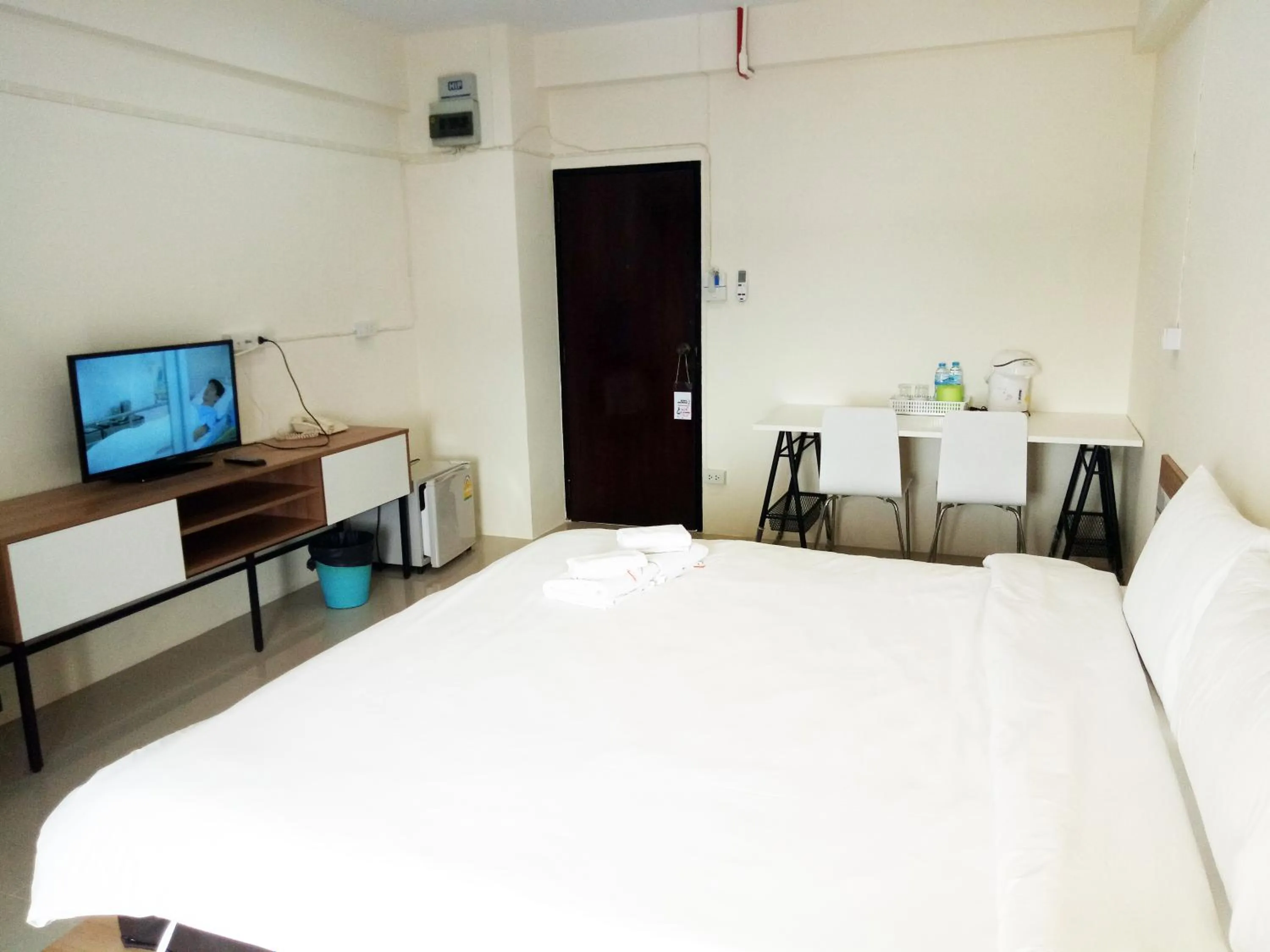 Bed in Komol Residence Bangkok