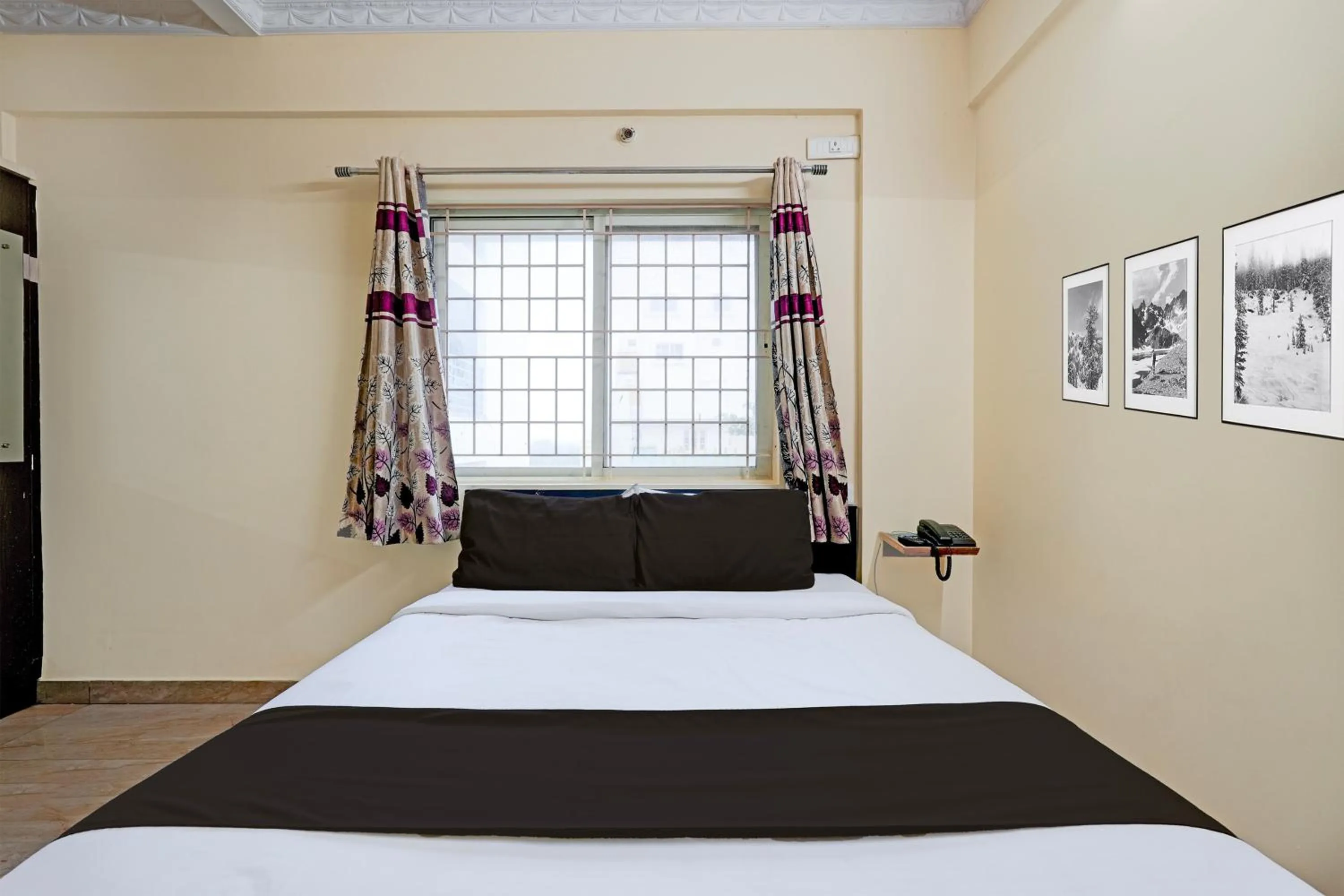 Bedroom in Hotel O Ganakkal Near BGS Hospital Junction formerly Omkar Inn.