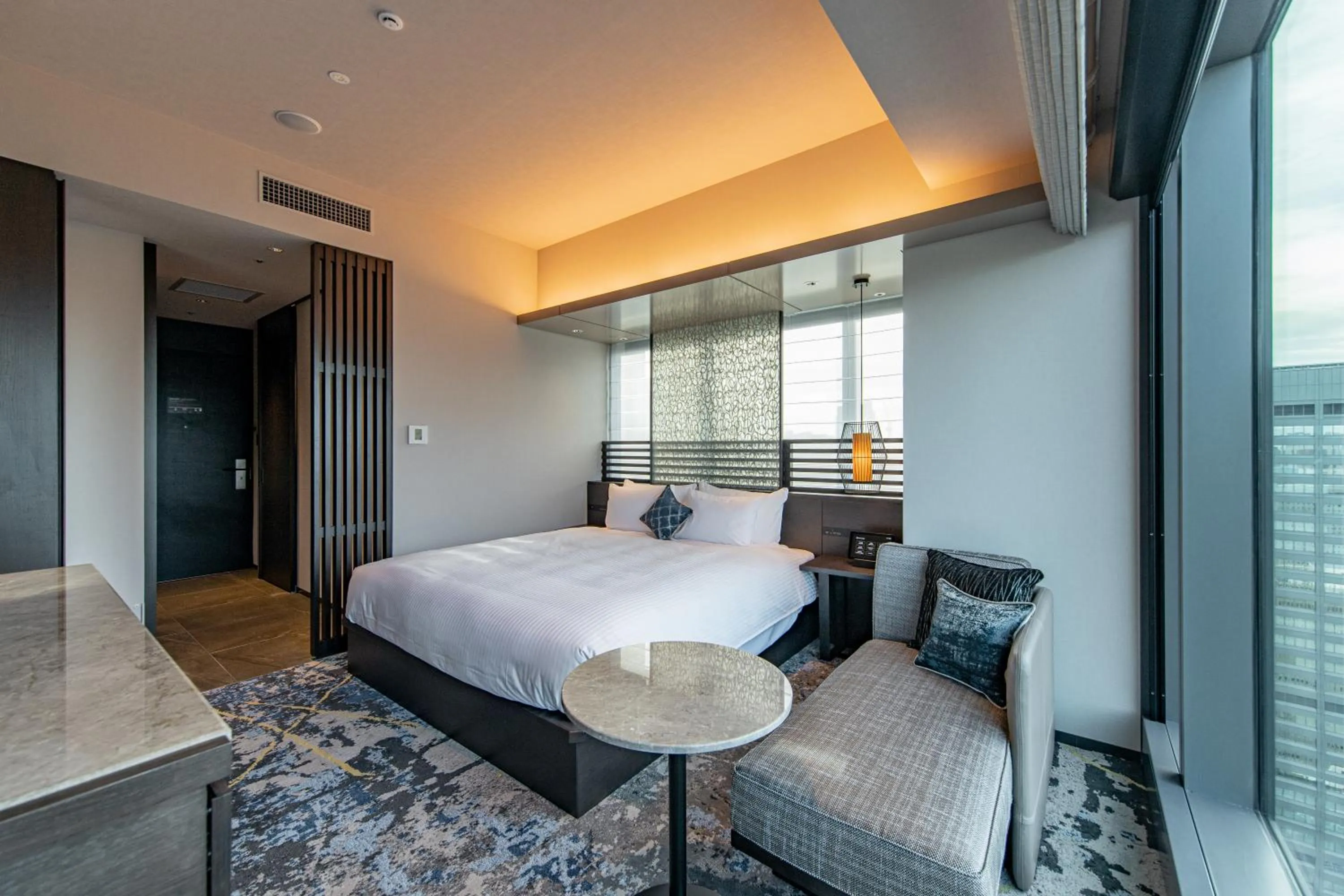 Bed in THE BLOSSOM HIBIYA