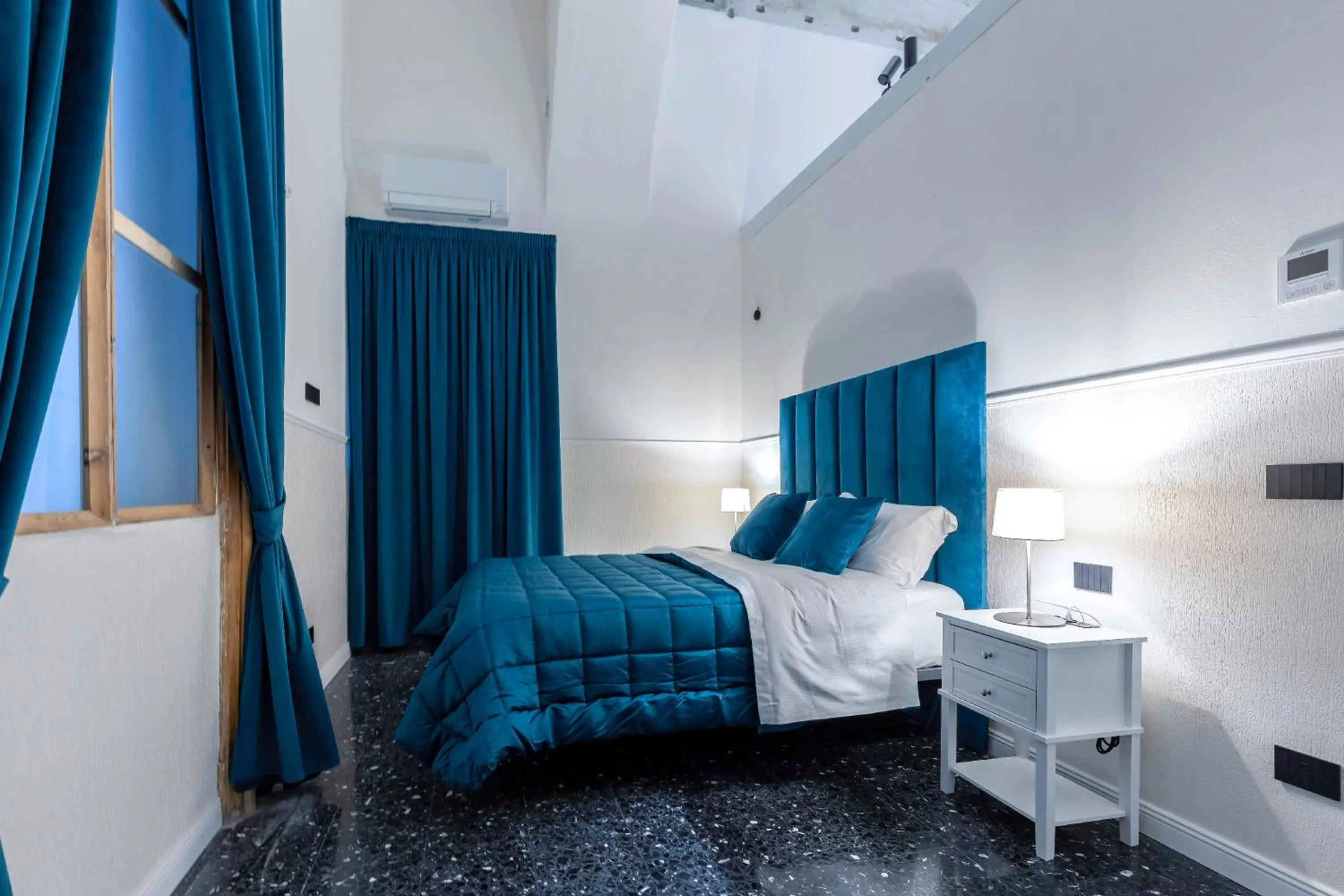 Bed in Il Tesoro Smart Suite & SPA