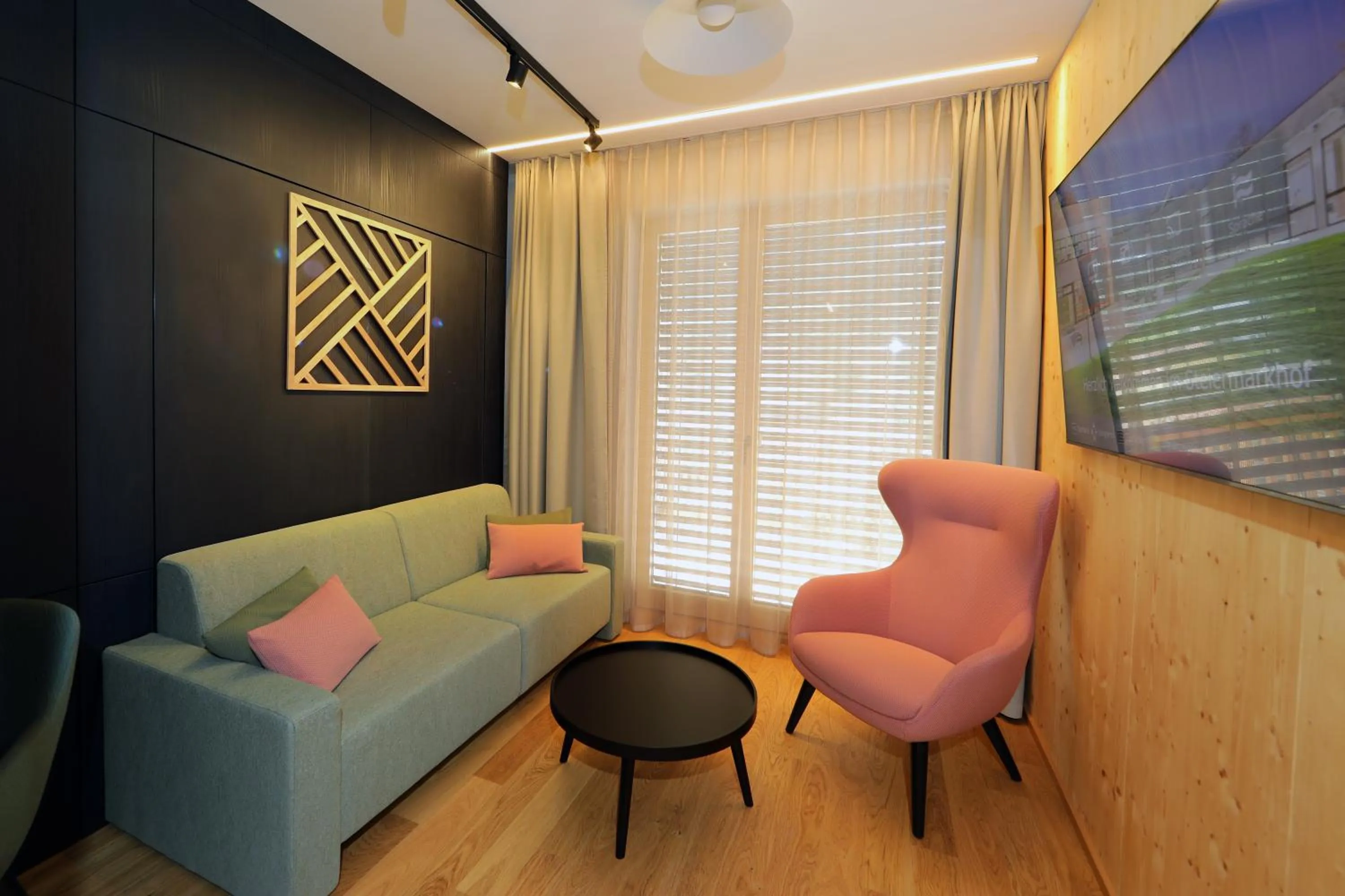 Living room in Hotel Steiermarkhof Graz - Aus Holz gebaut, von Hügeln geküsst