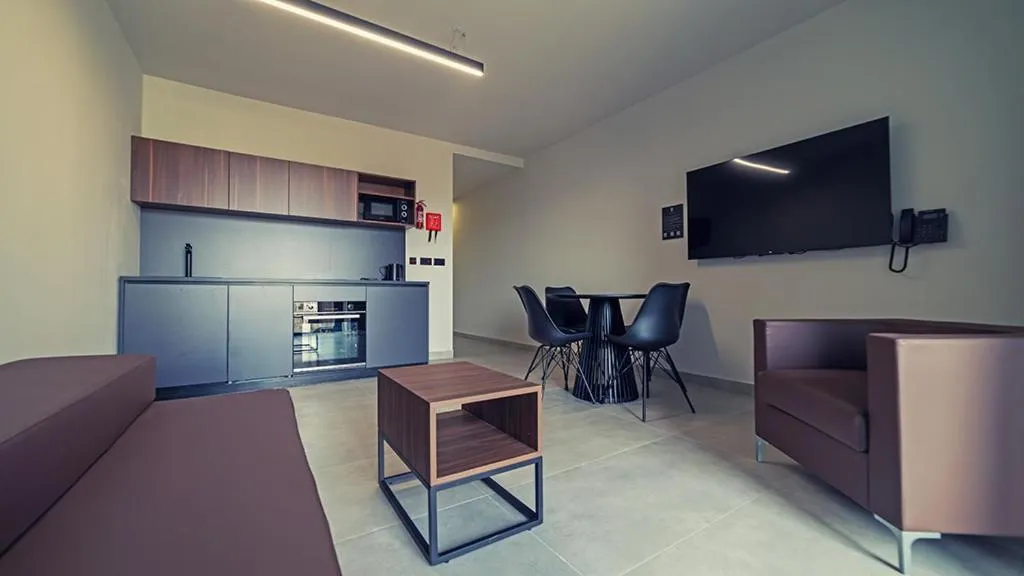 Communal lounge/ TV room in Onyx Hotel