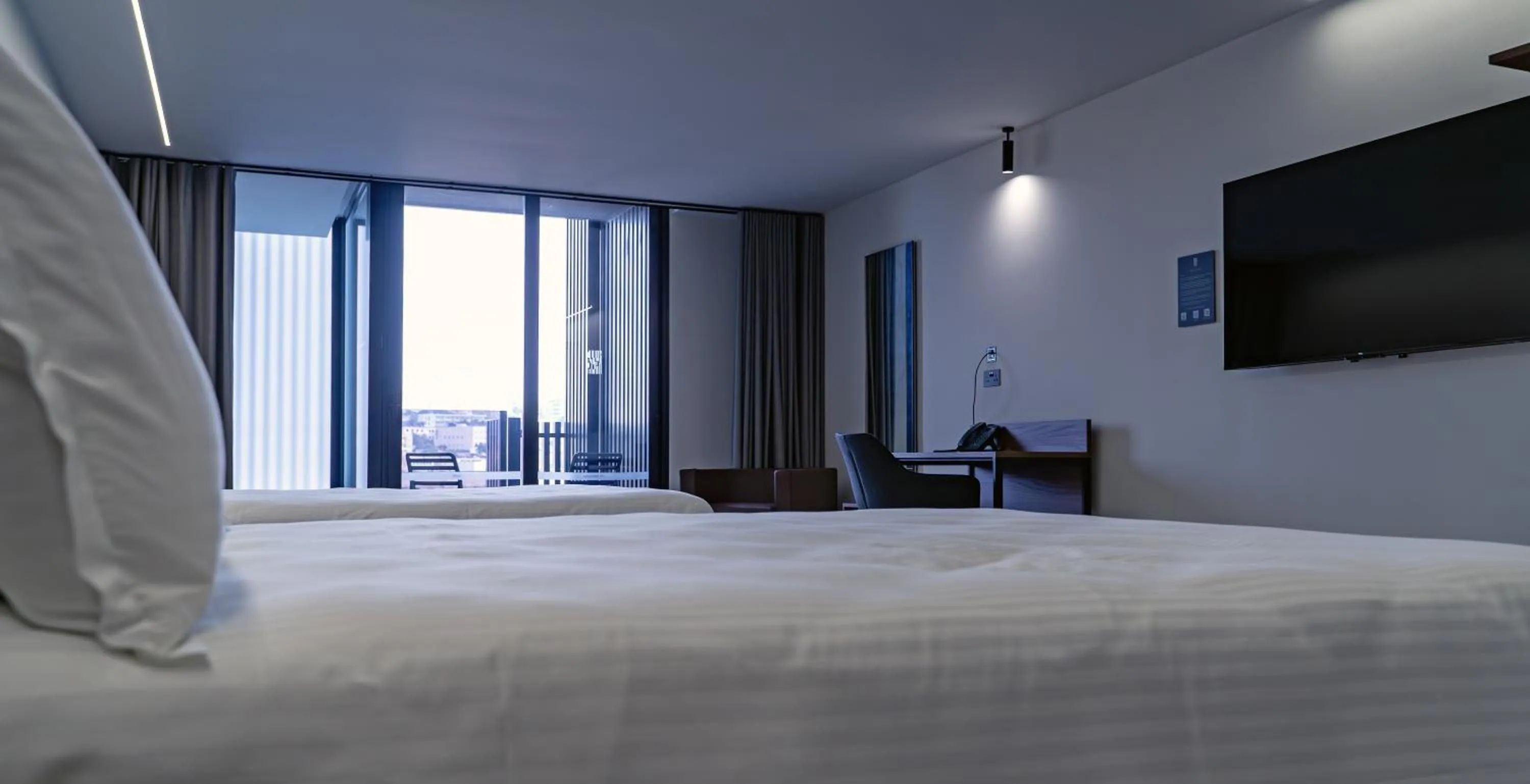 Bed in Onyx Suites & Apartments