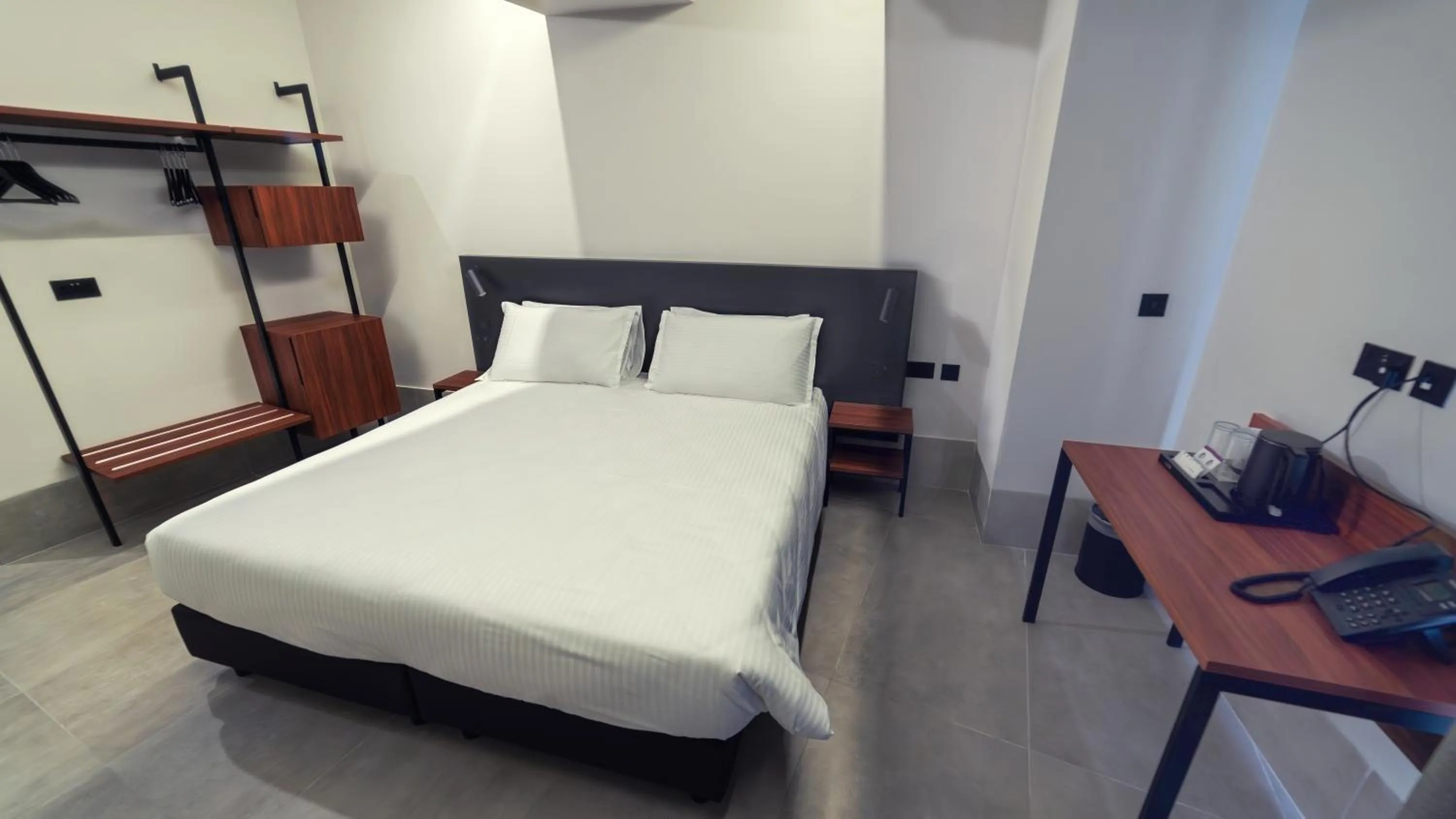 Bed in Onyx Suites & Apartments