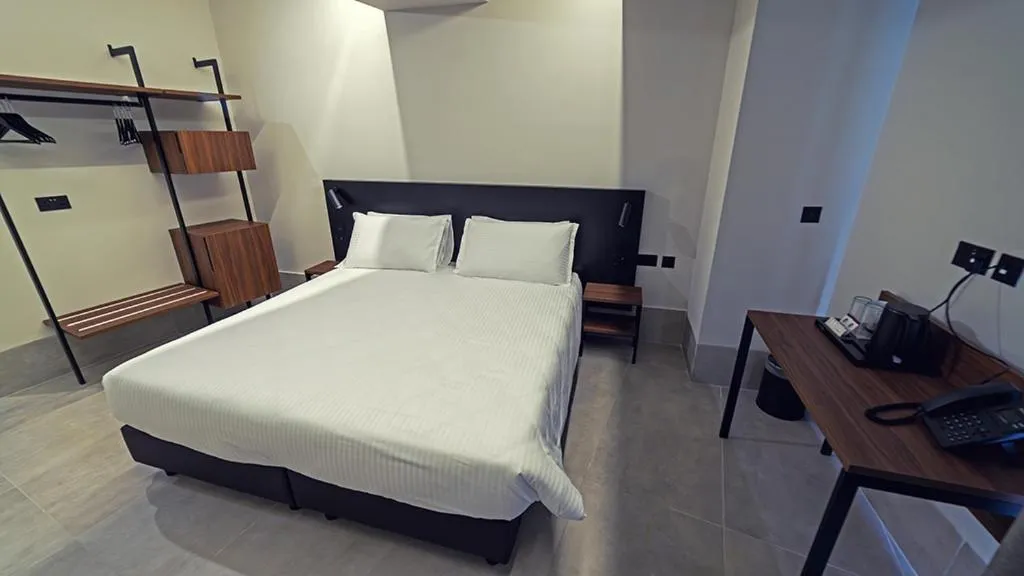 Bed in Onyx Suites & Apartments