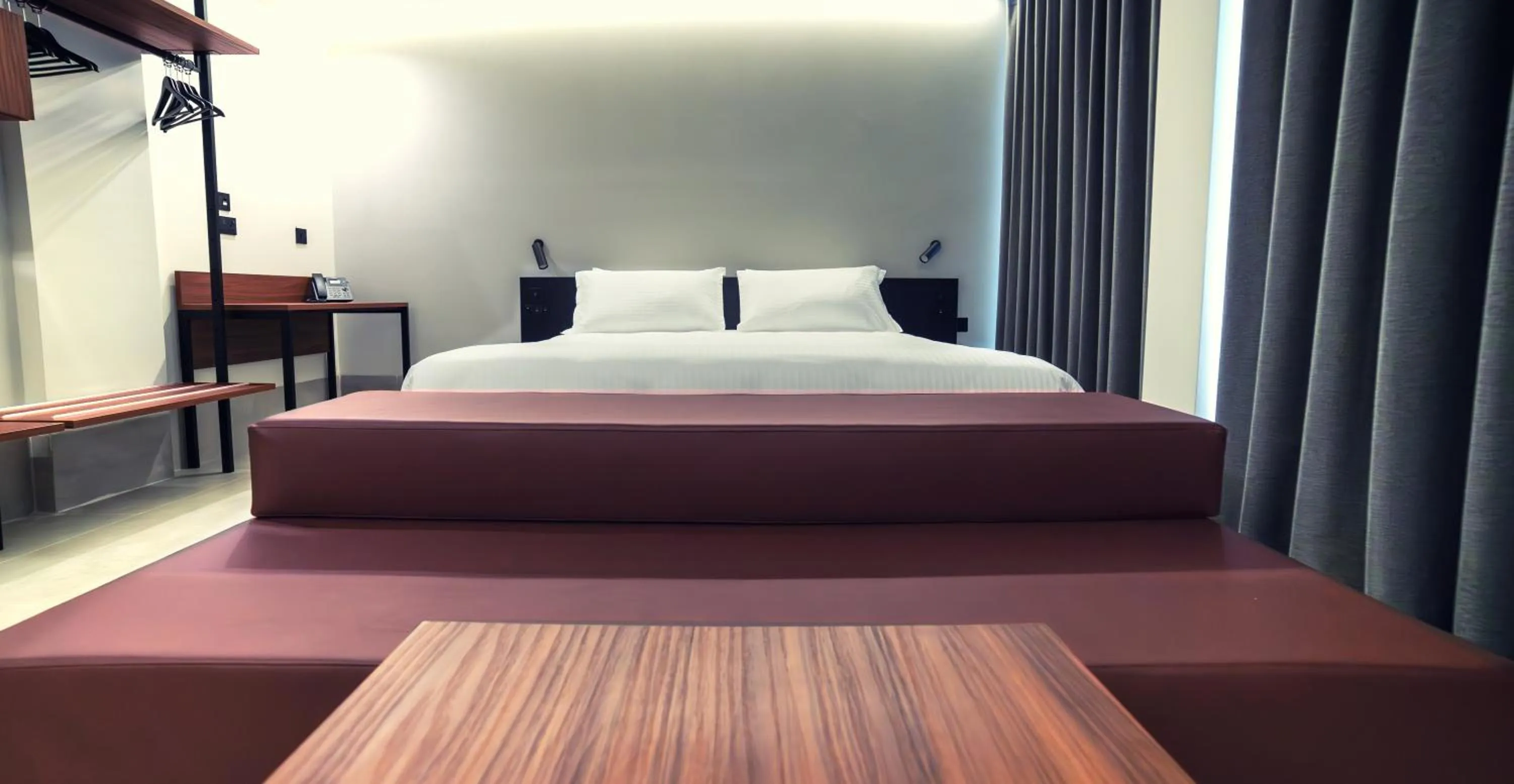 Bed in Onyx Suites & Apartments