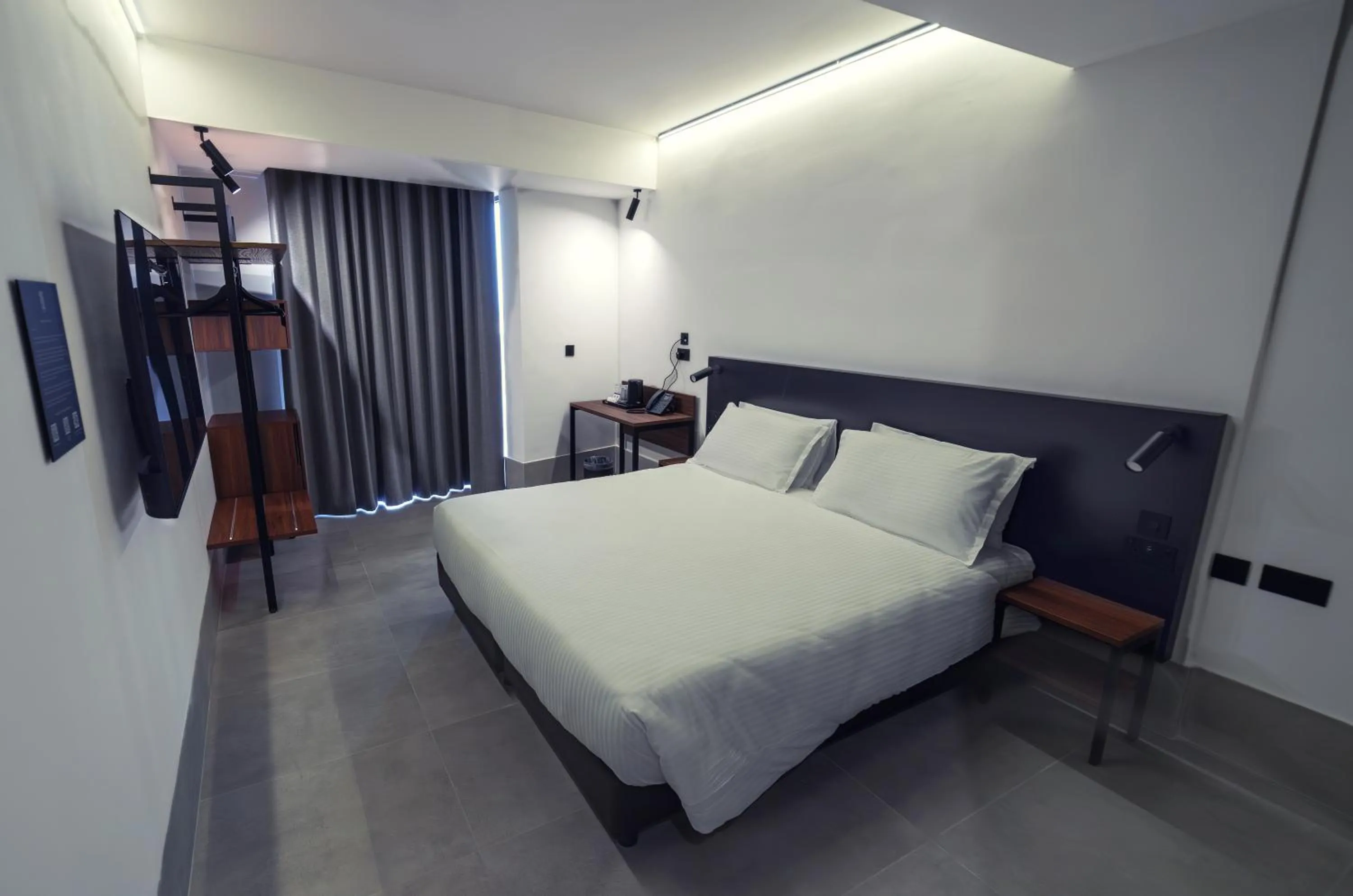 Bed in Onyx Suites & Apartments