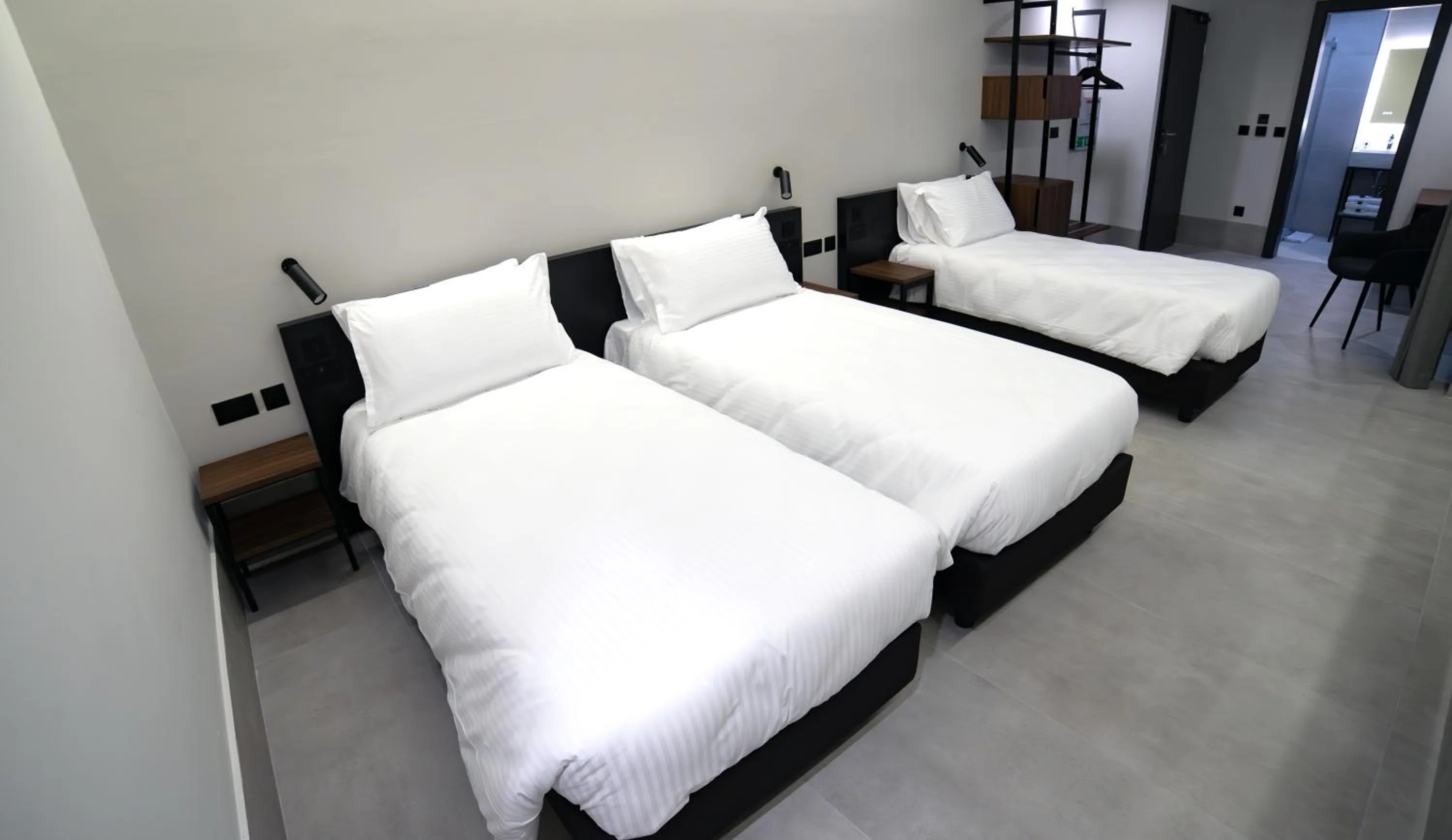 Bed in Onyx Suites & Apartments