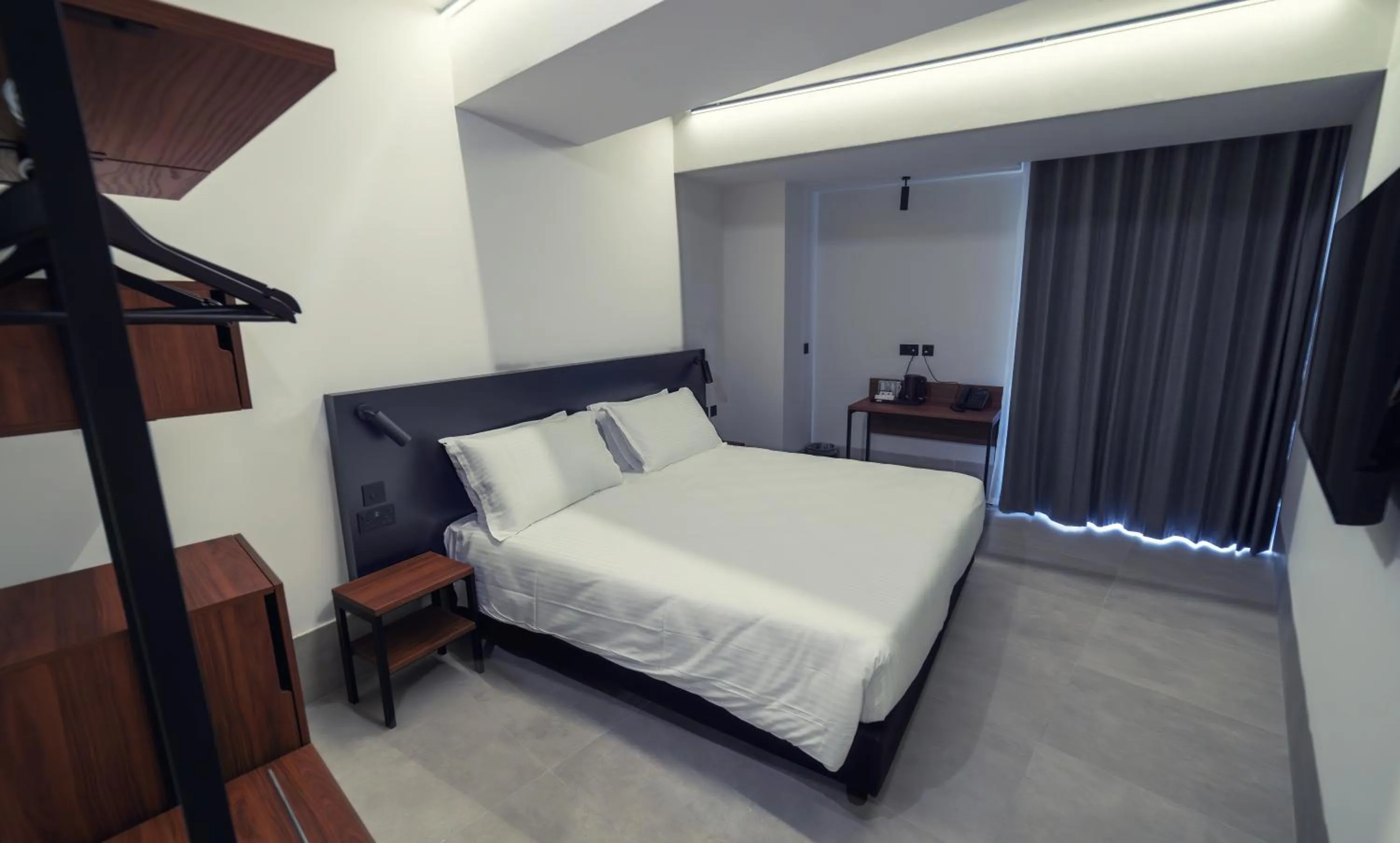 Bed in Onyx Suites & Apartments
