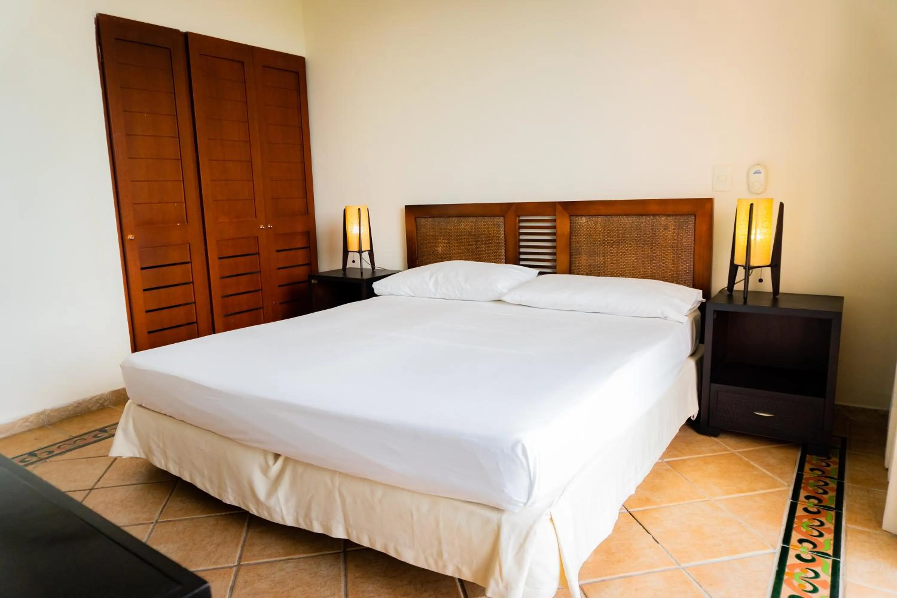 Bed in Hotel Peñon Suites