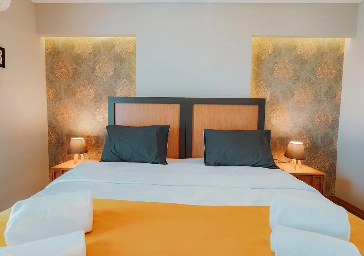 Bed in Umut Apartments