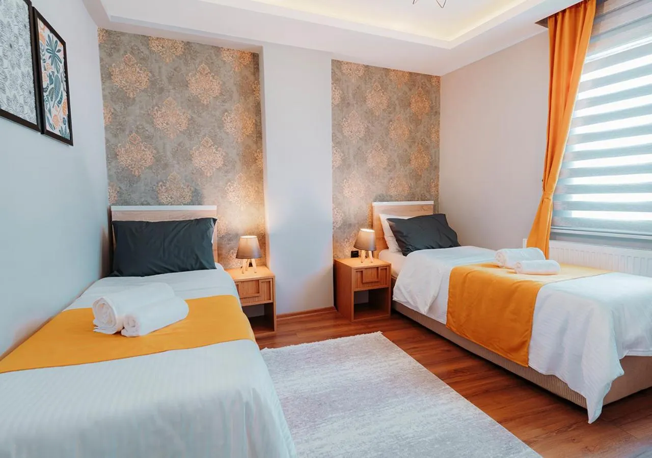 Bed in Umut Apartments