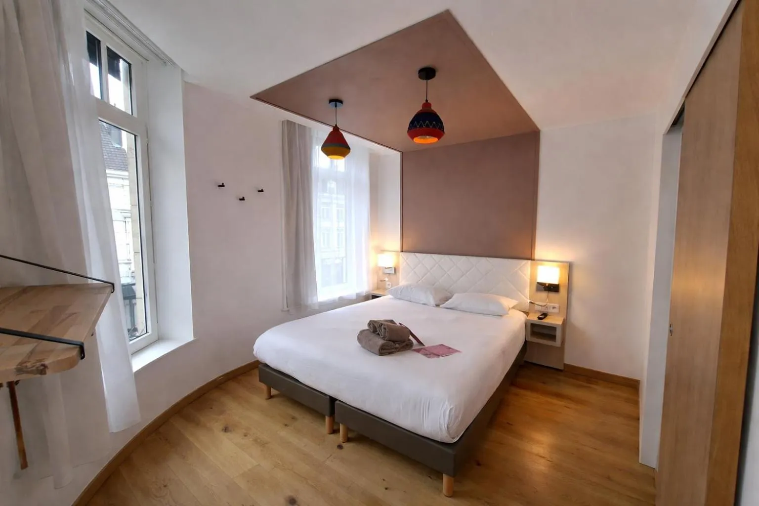 Bed in HOTEL AMBASSADEUR