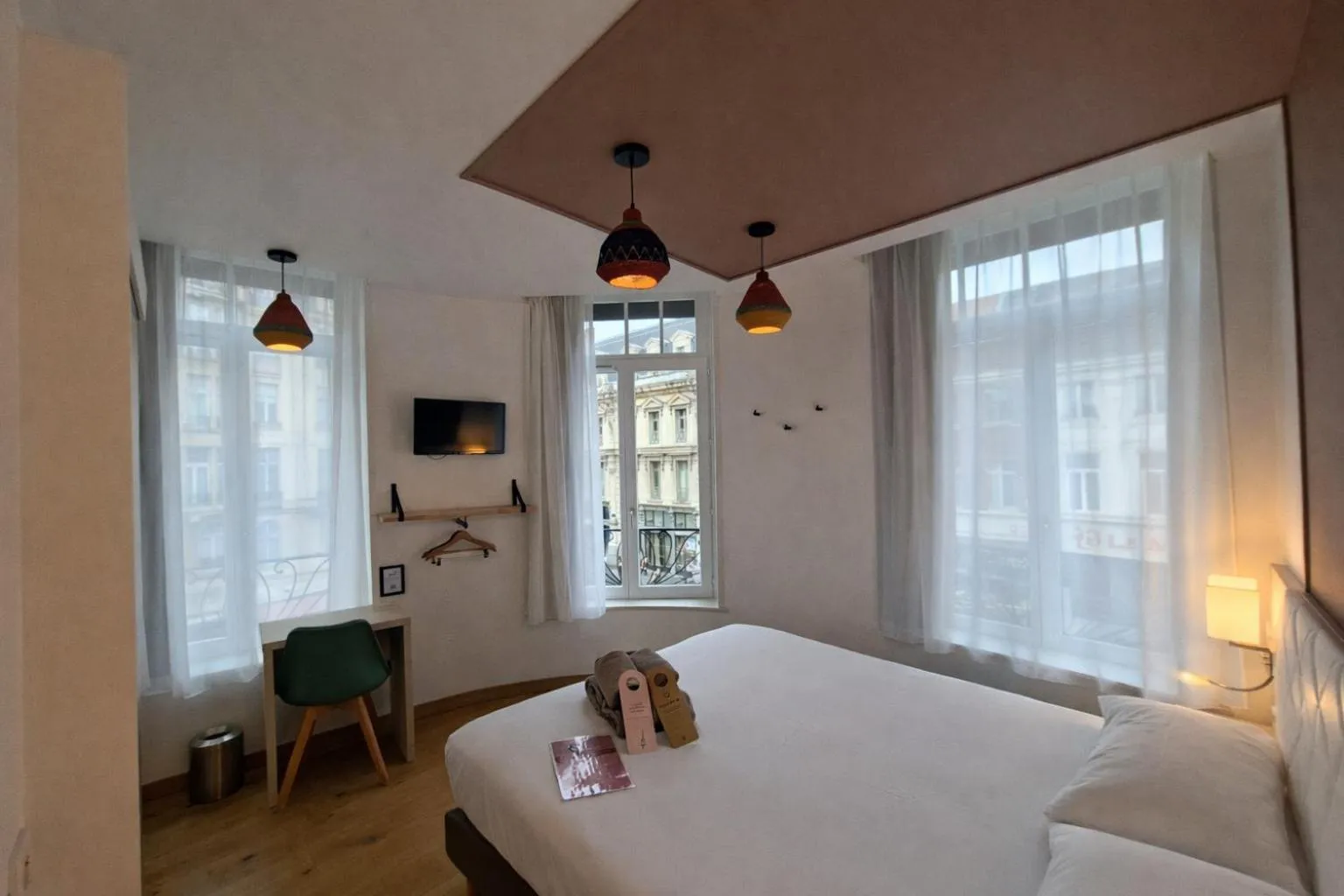 Bed in HOTEL AMBASSADEUR