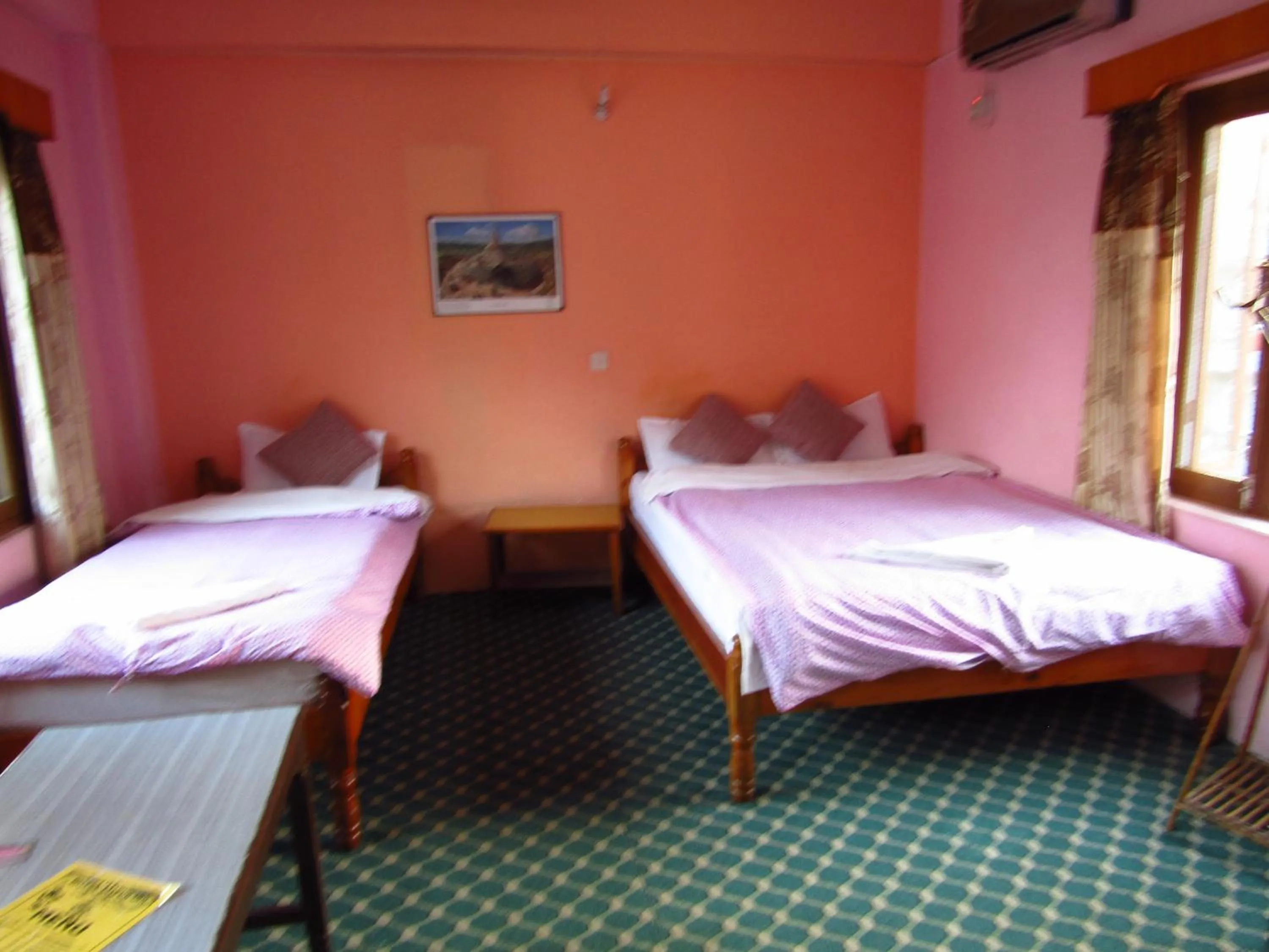 Bed in Hotel Lotus Inn
