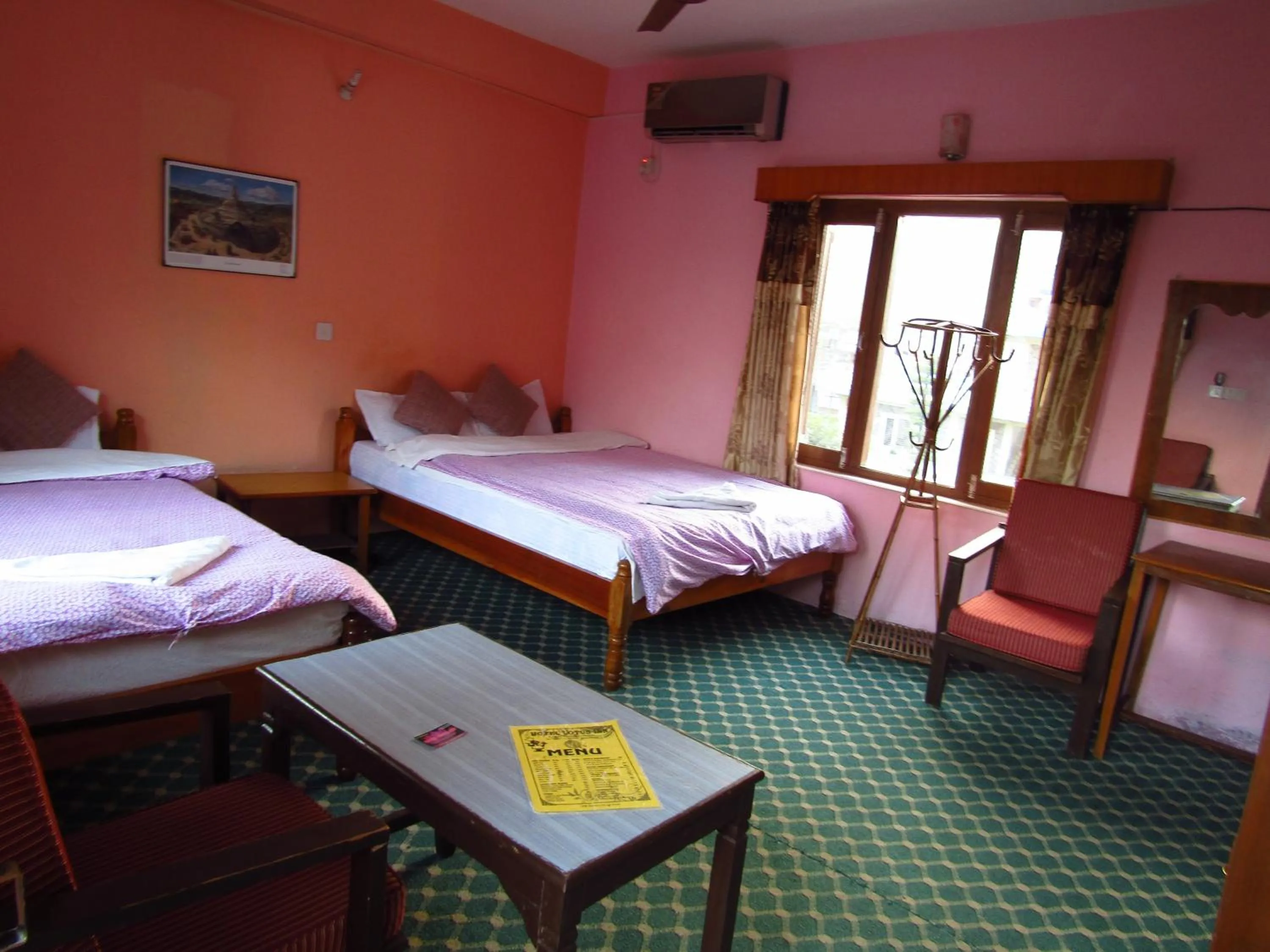 Bed in Hotel Lotus Inn