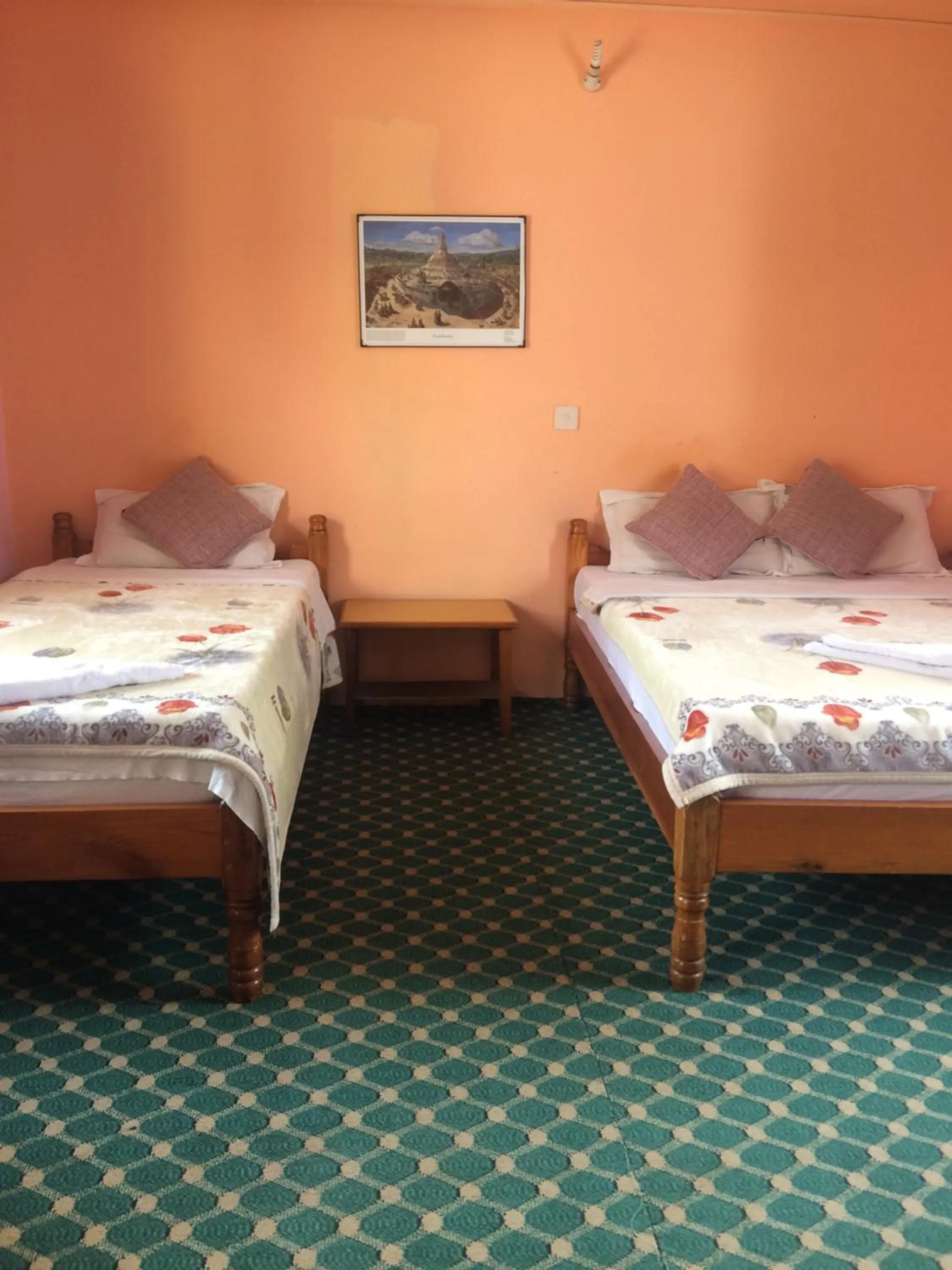 Bed in Hotel Lotus Inn