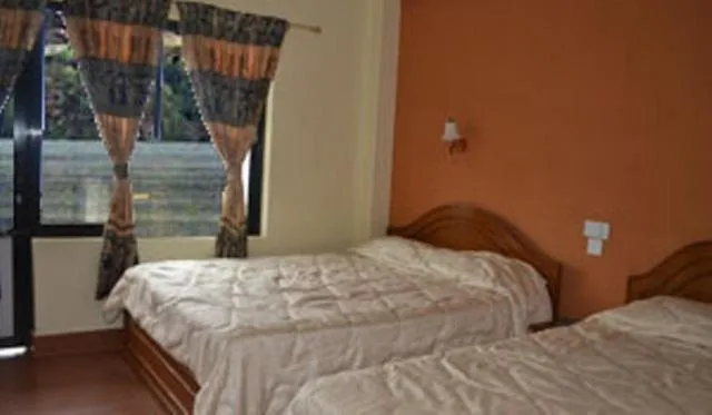 Bed in Hotel Lotus Inn