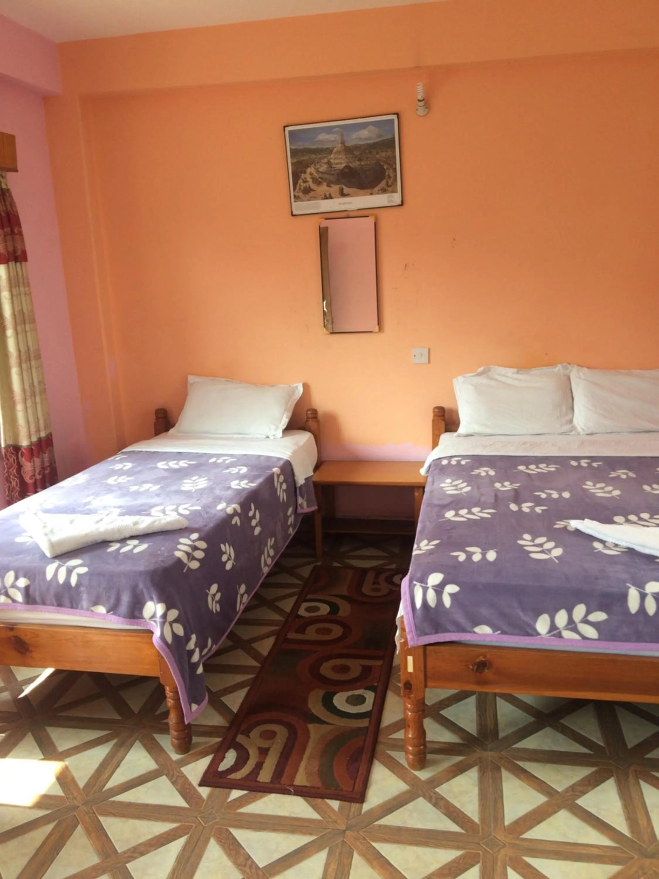 Bed in Hotel Lotus Inn