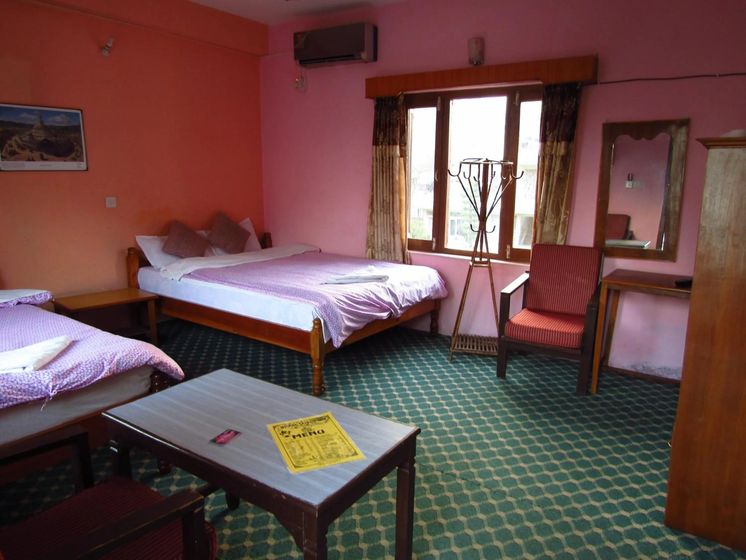 Bed in Hotel Lotus Inn