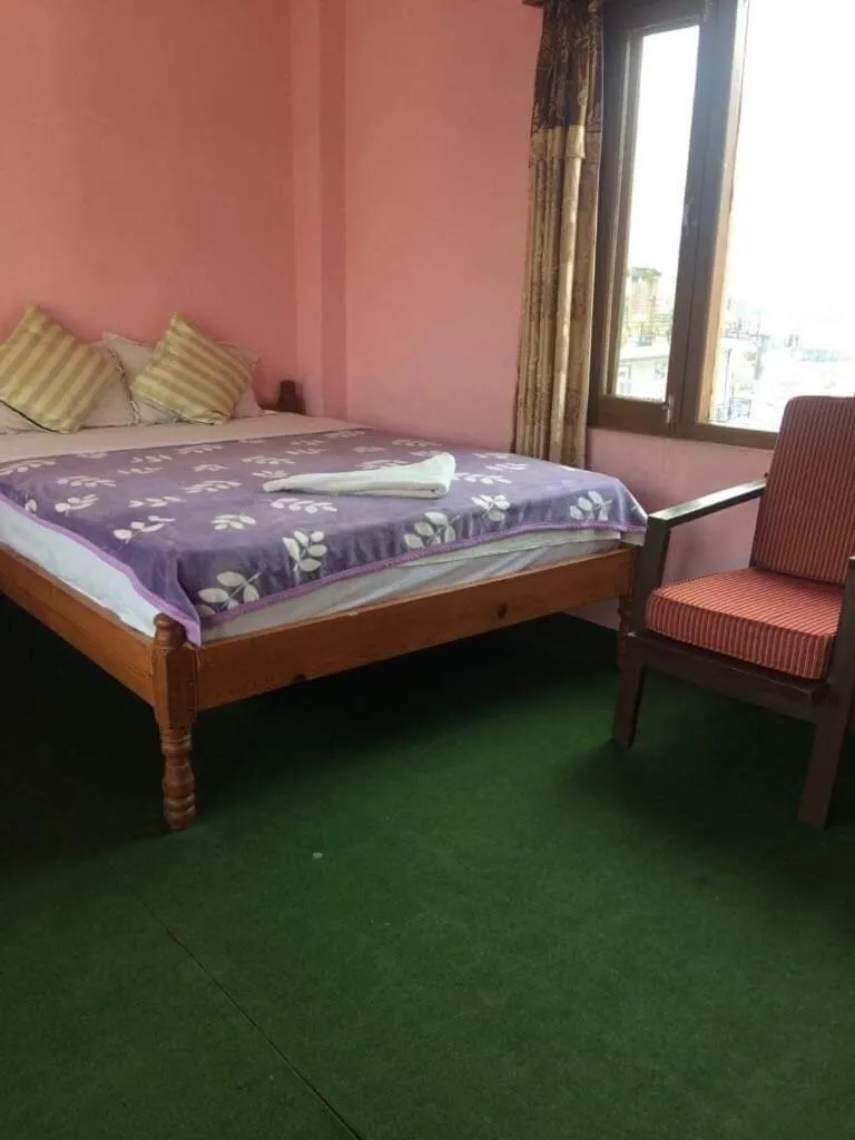 Bed in Hotel Lotus Inn