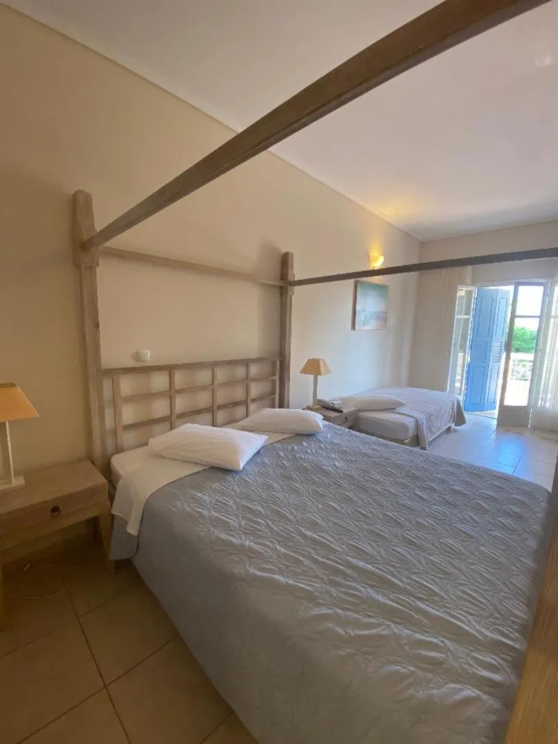 Bedroom, Bed in Alonissos Beach Bungalows And Suites Hotel