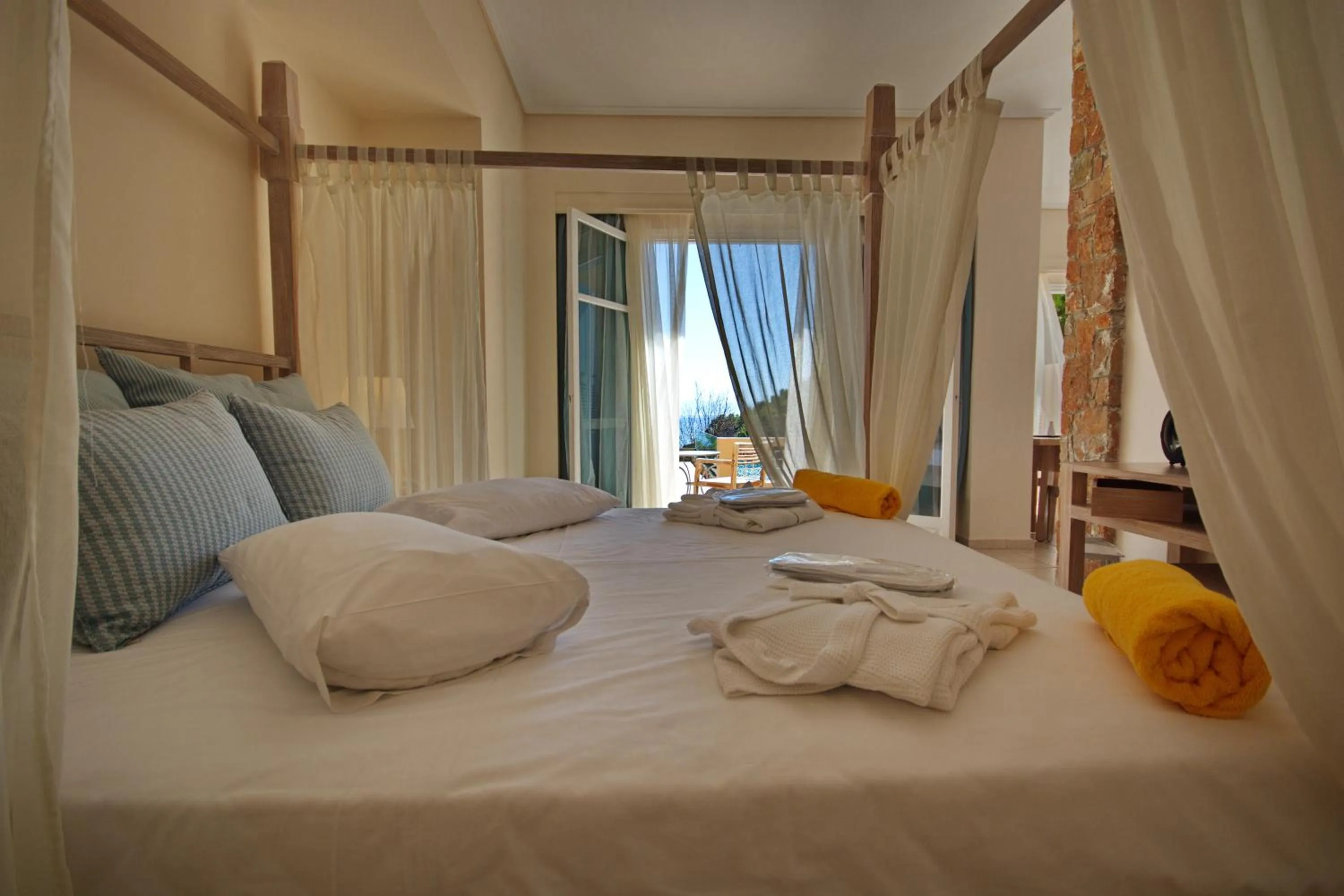 Bedroom, Bed in Alonissos Beach Bungalows And Suites Hotel