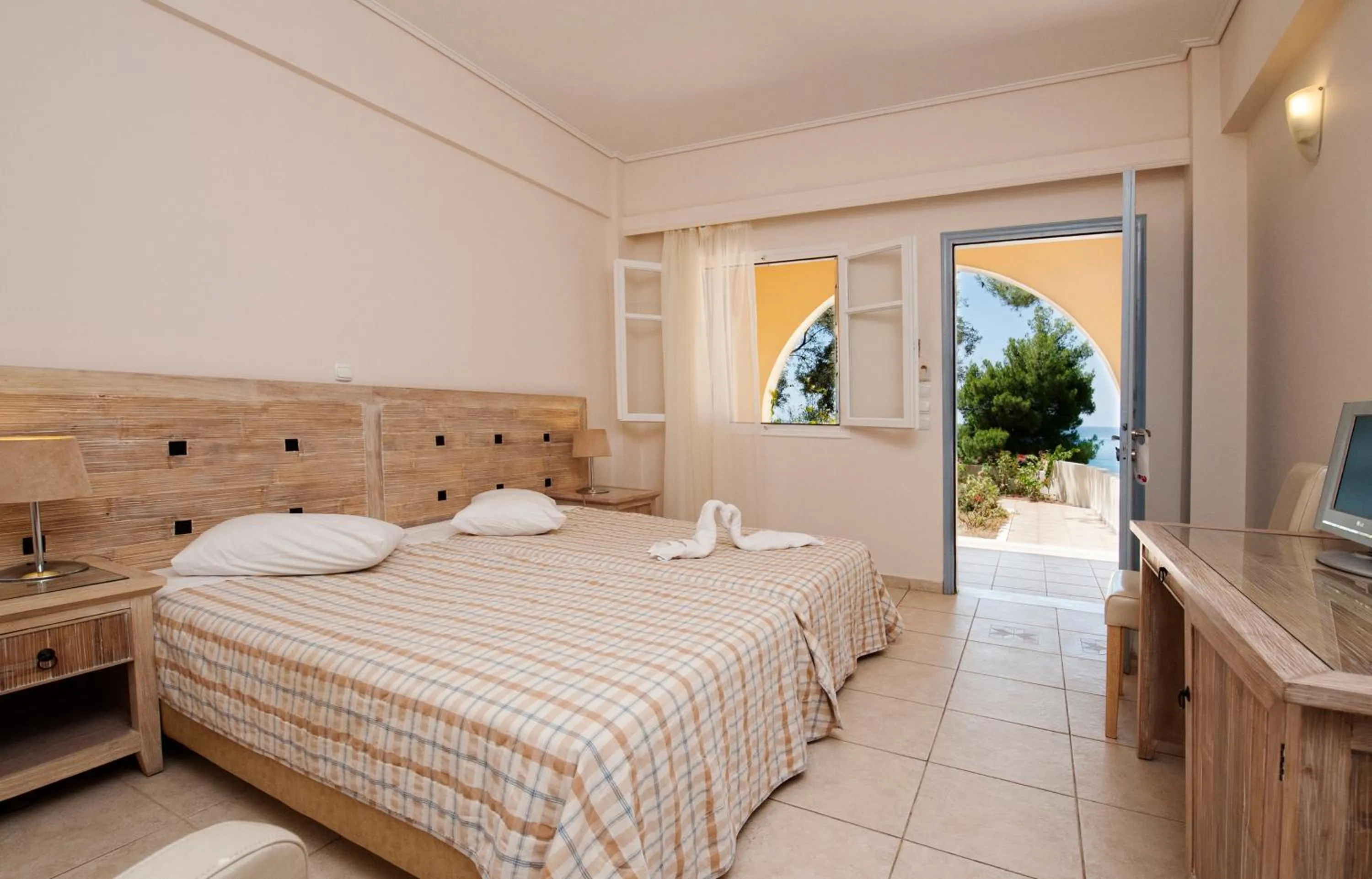 Bed in Alonissos Beach Bungalows And Suites Hotel