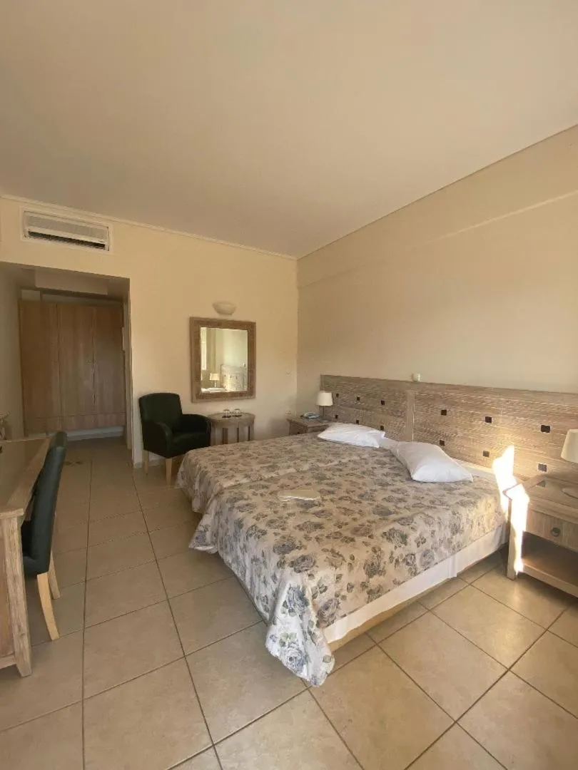 Bedroom, Bed in Alonissos Beach Bungalows And Suites Hotel