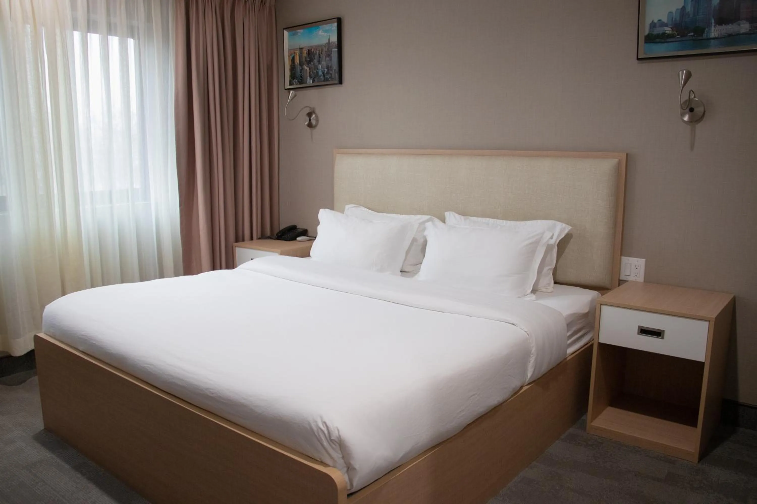 Bed in LIC Plaza Hotel