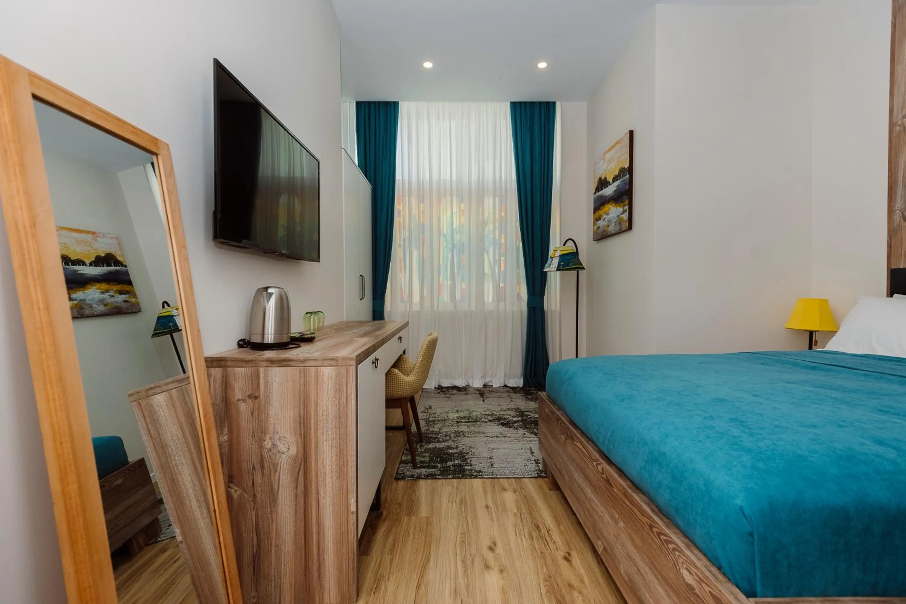 Communal lounge/ TV room, Bed in Boulevard Hotel Batumi