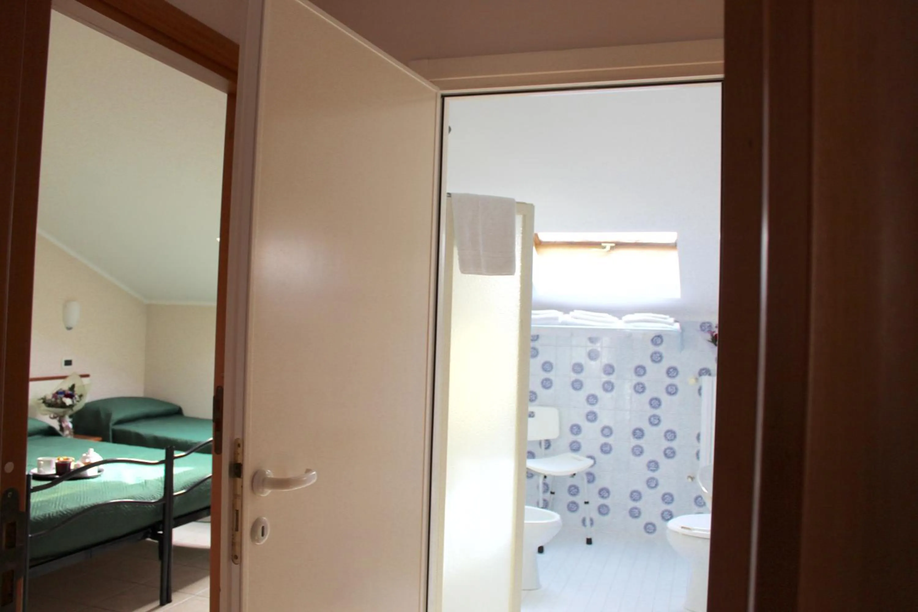 Bathroom, Bed in Blue Hotel