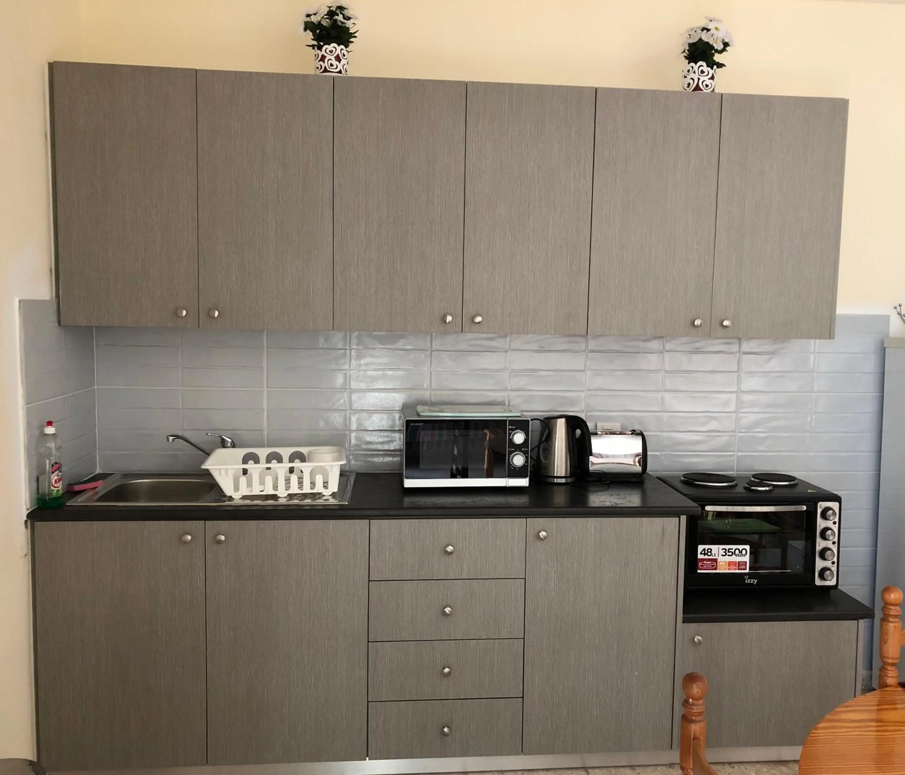 Kitchen or kitchenette in Angela Holiday Apartments