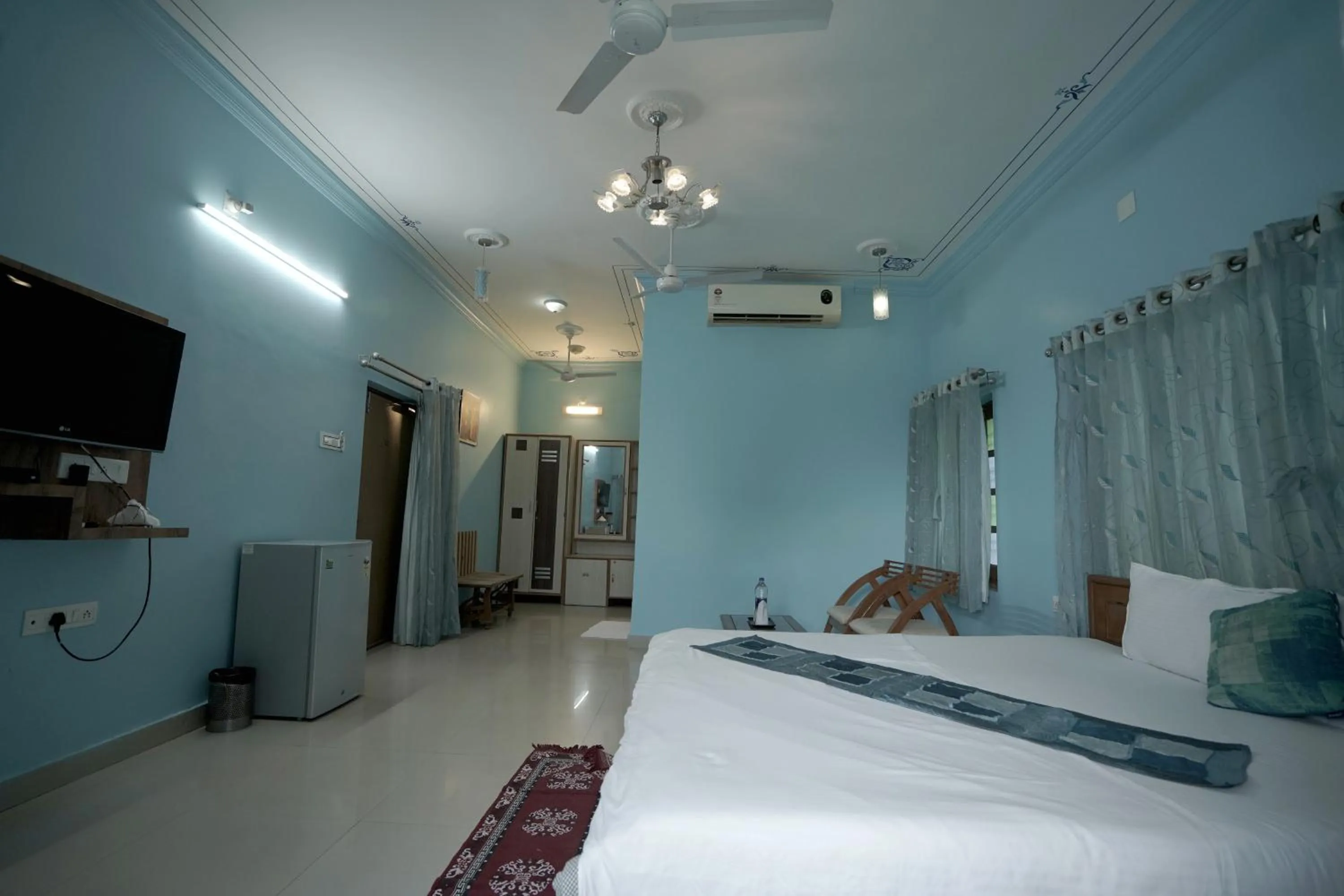 Photo of the whole room, Bed in Devendragarh Palace - Luxury Paying Guest House