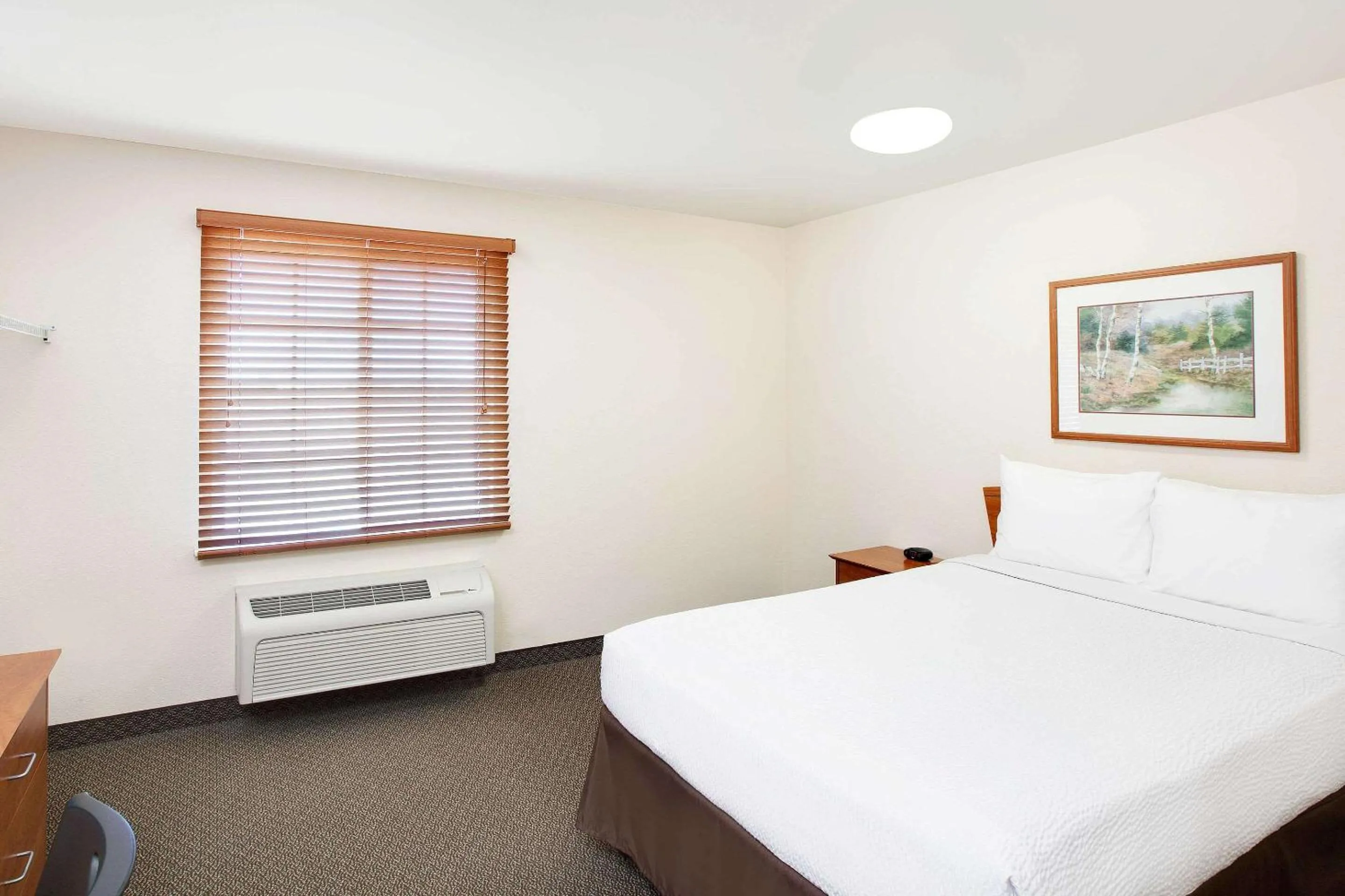 Photo of the whole room, Bed in WoodSpring Suites Tyler Rose Garden