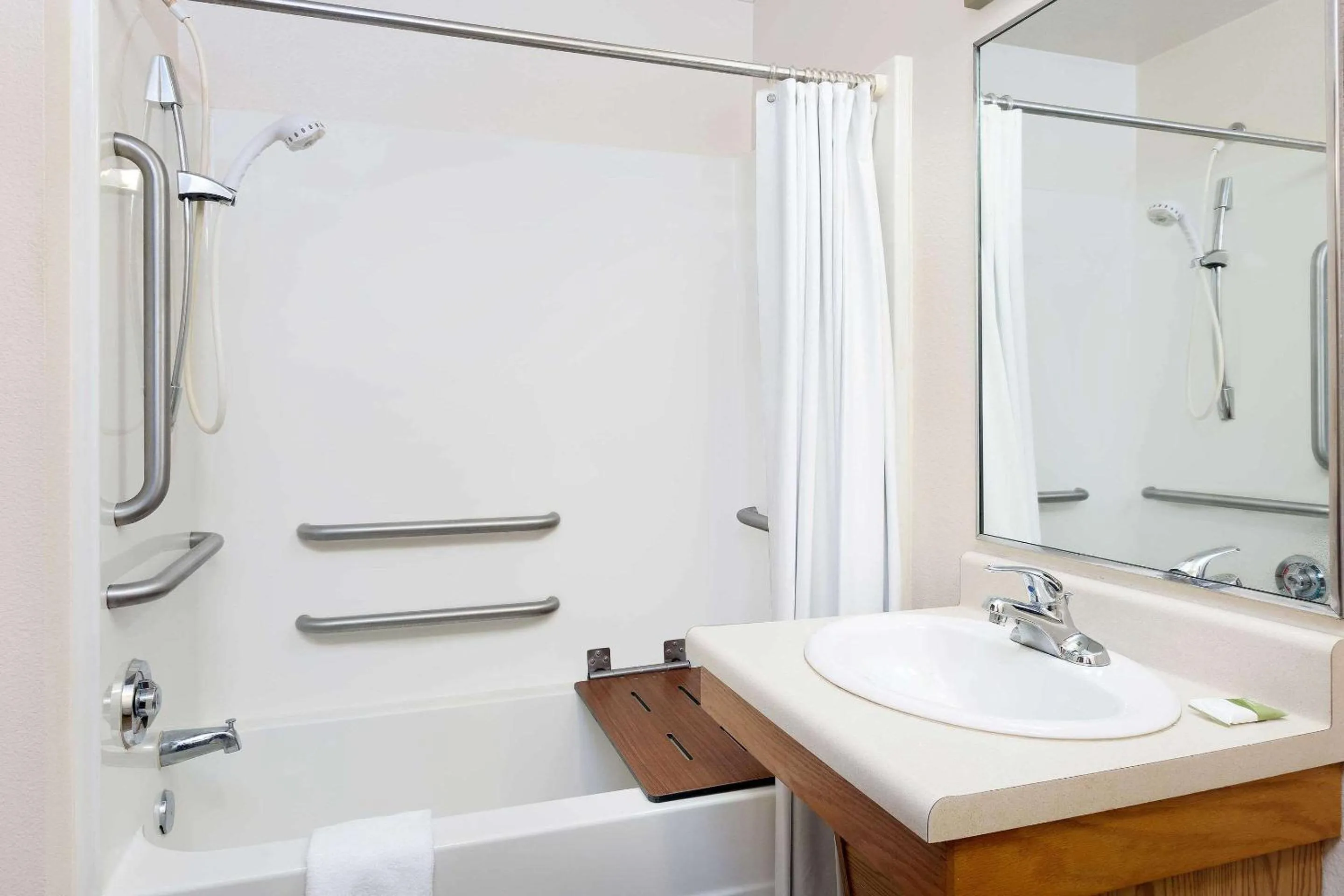 Bathroom in WoodSpring Suites Tyler Rose Garden