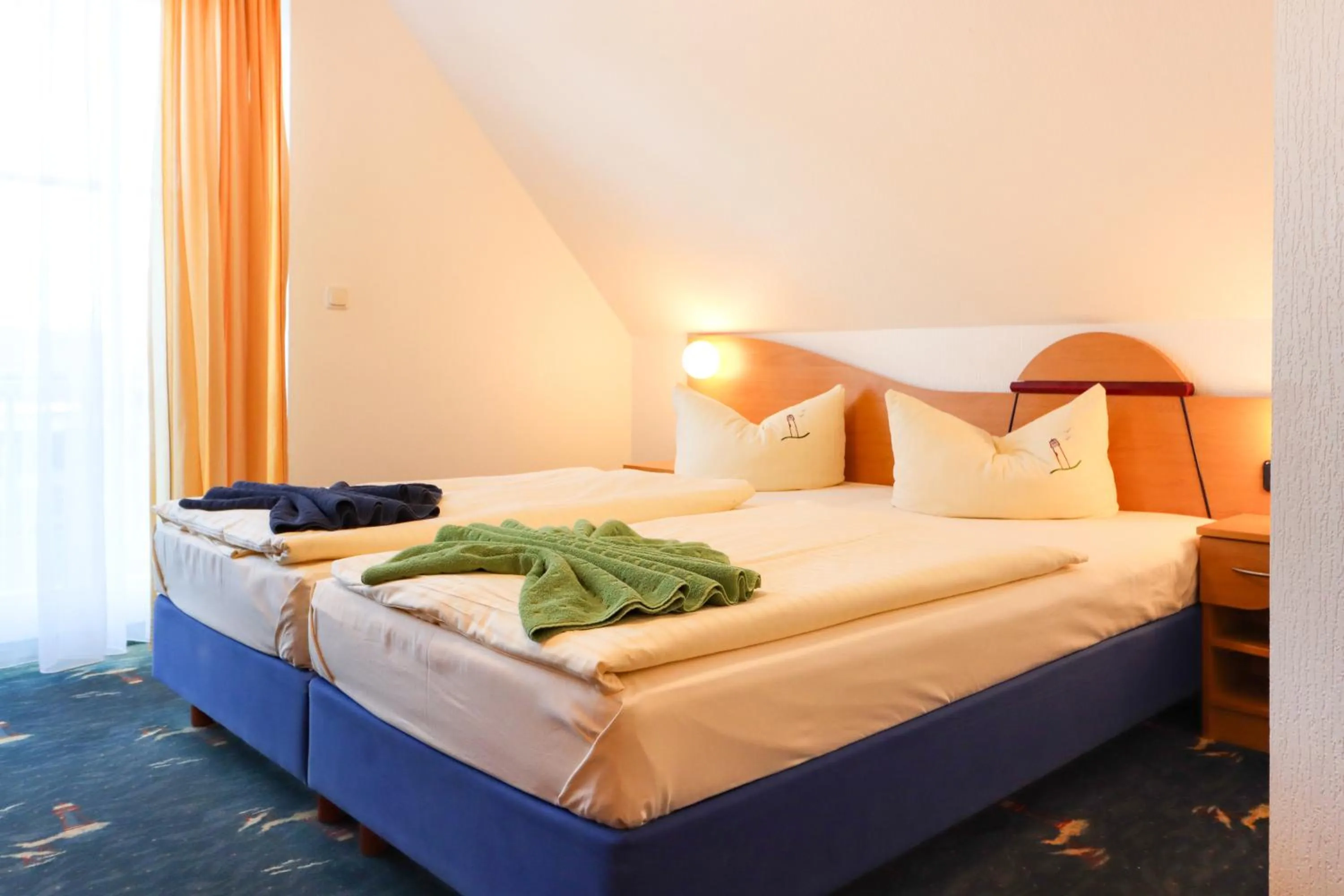 Bed in Aparthotel Leuchtfeuer Rügen