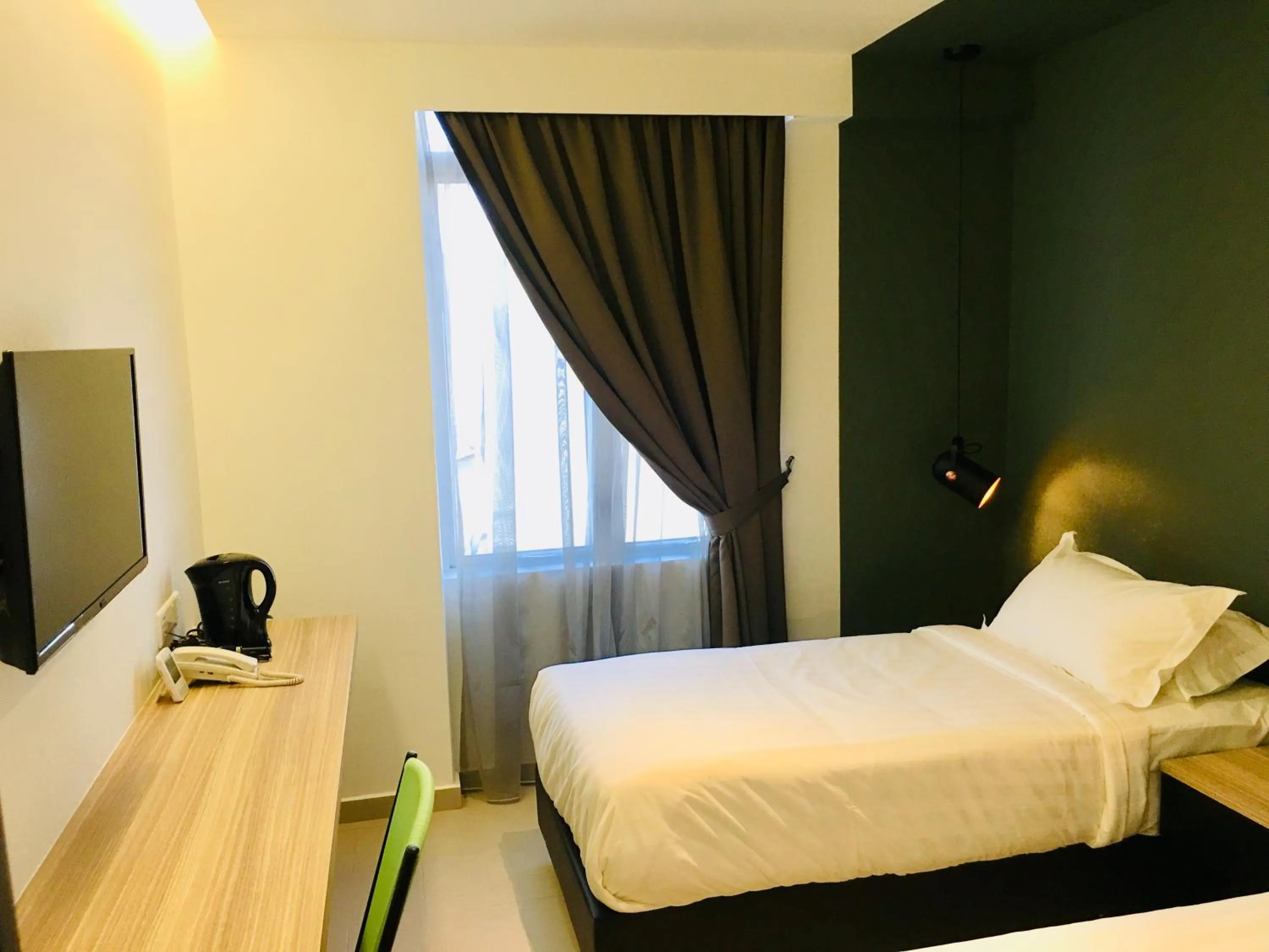 Bed in Enclave Business Hotel